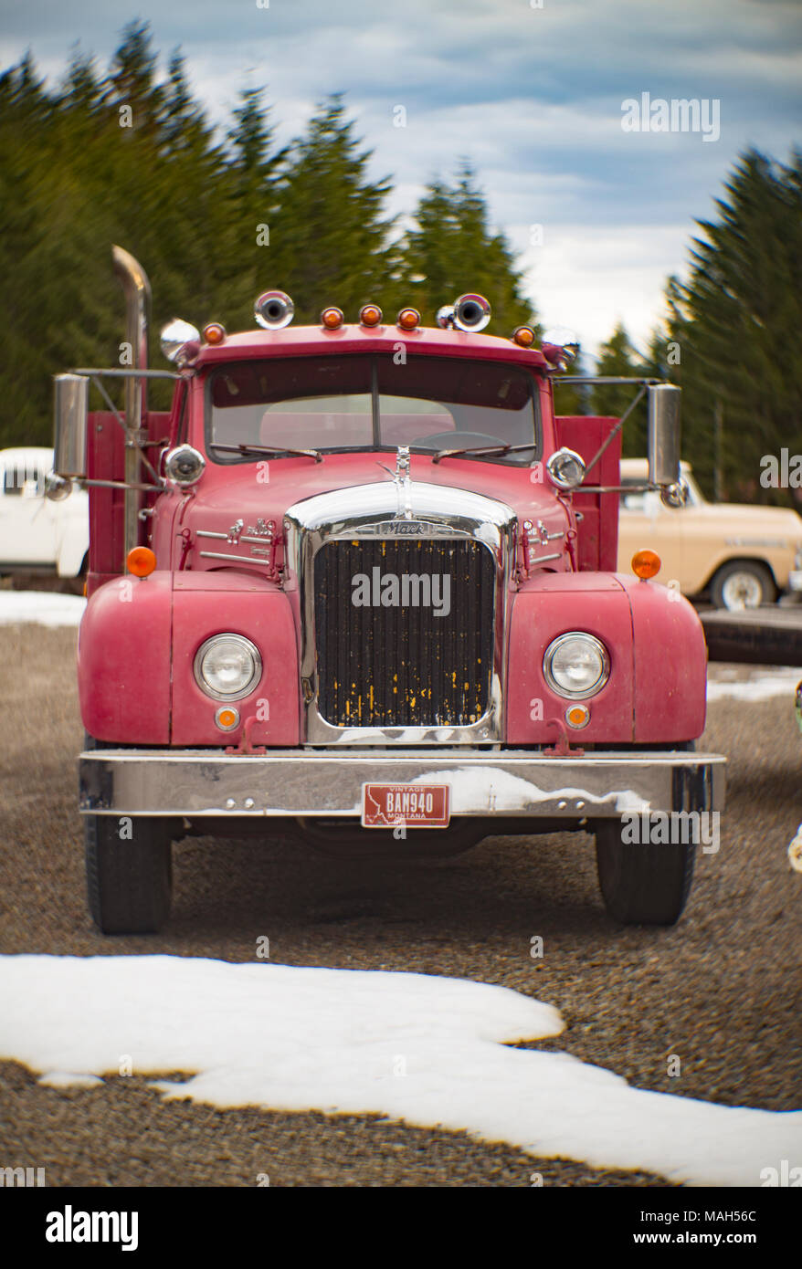 A red Mack B-75 stake body work truck, near Noxon, Montana. Mack's B Series trucks were produced from 1953 and 1966. Stock Photo