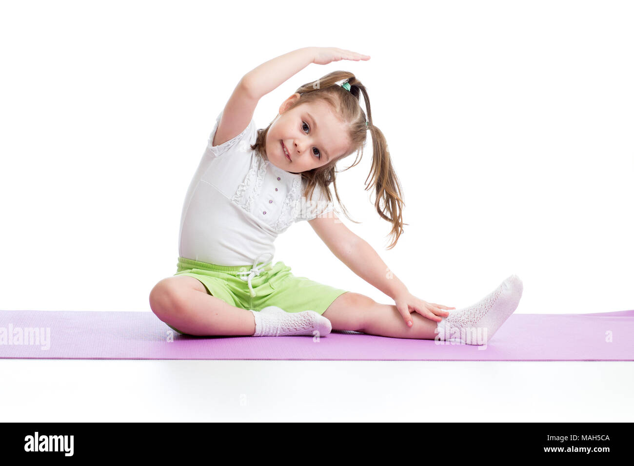 Adorable little child doing splits with mother's support while following  on-screen instructor at home. Happy caucasian ladies in black wear enjoying  baby yoga without leaving comfort of room Stock Photo - Alamy