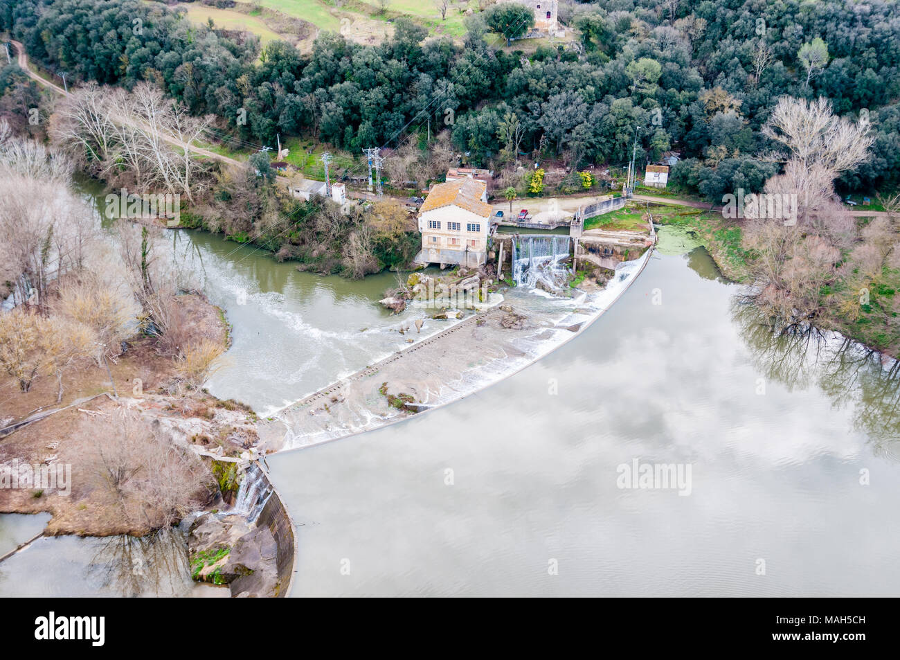 aerial view of water channel, dam and hydroelectric power station Stock Photo