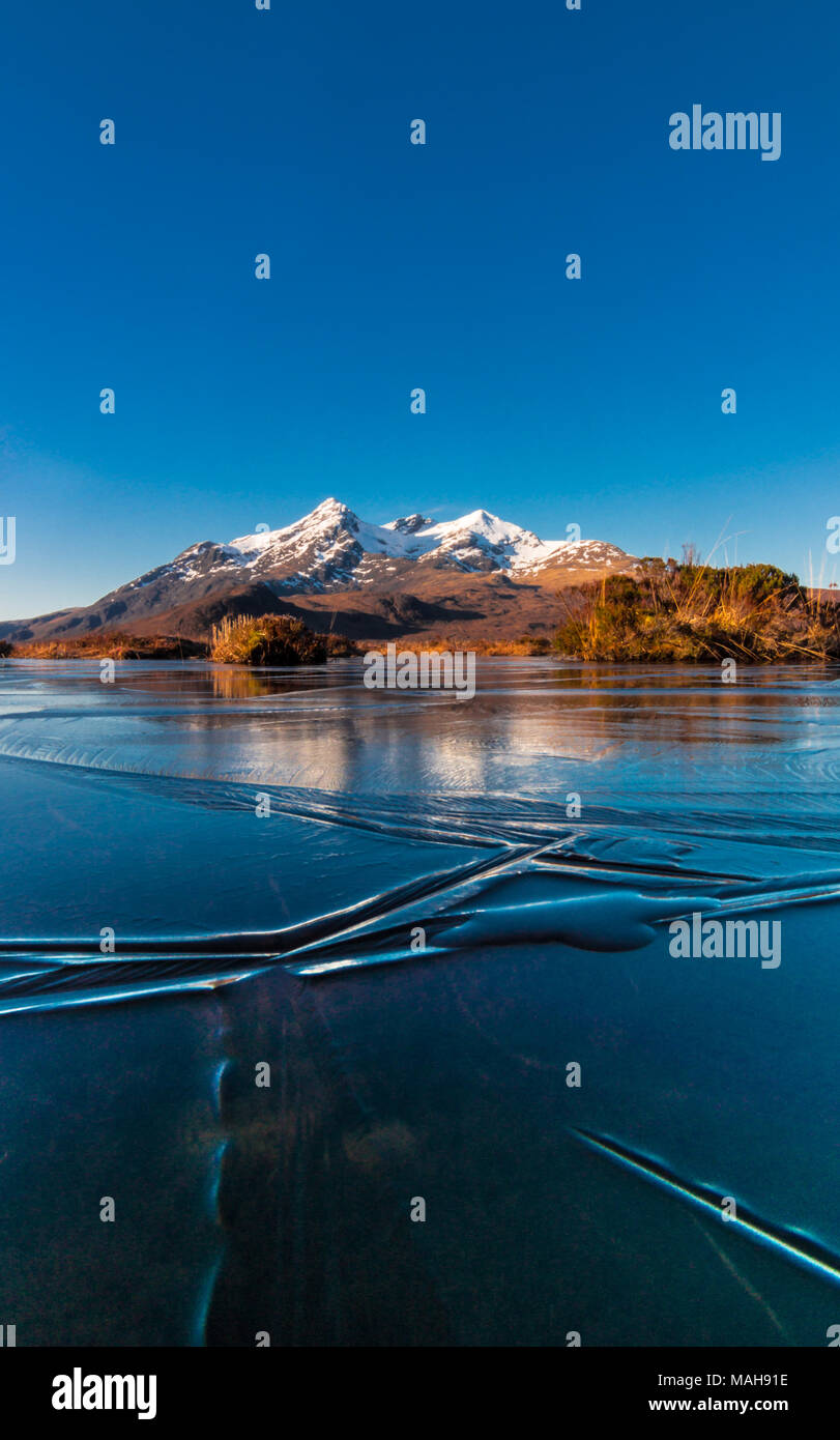 Frozen Reflections of the Cuillin Ridge, Isle of Skye Stock Photo