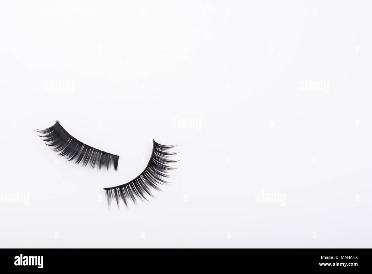 Black false eyelashes isolated on white background Stock Photo - Alamy