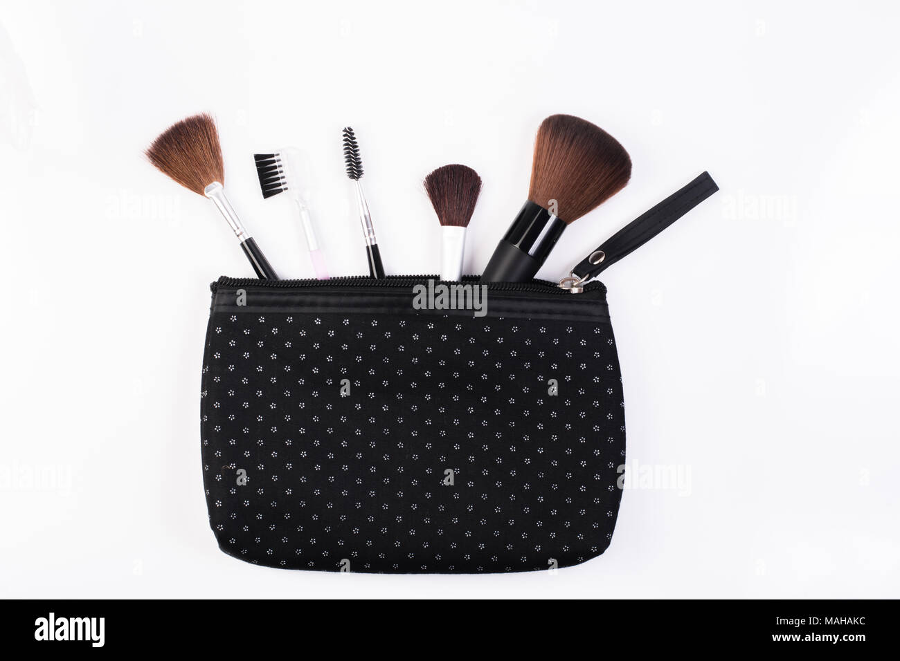 Makeup Brushes in comestic bag  isolated on white background. Stock Photo