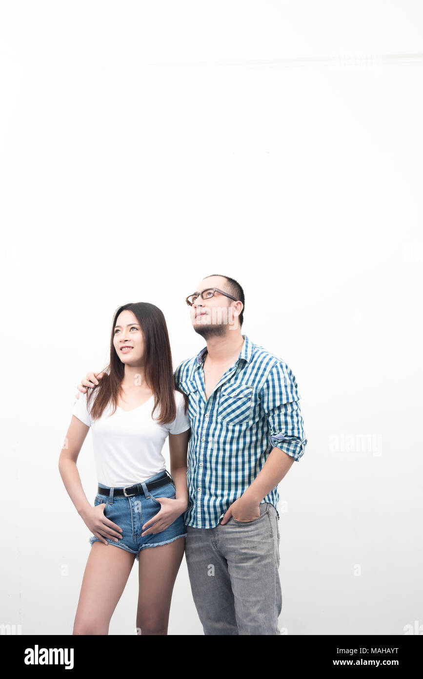 Portrait of young happy couple isolated on white background Stock Photo ...