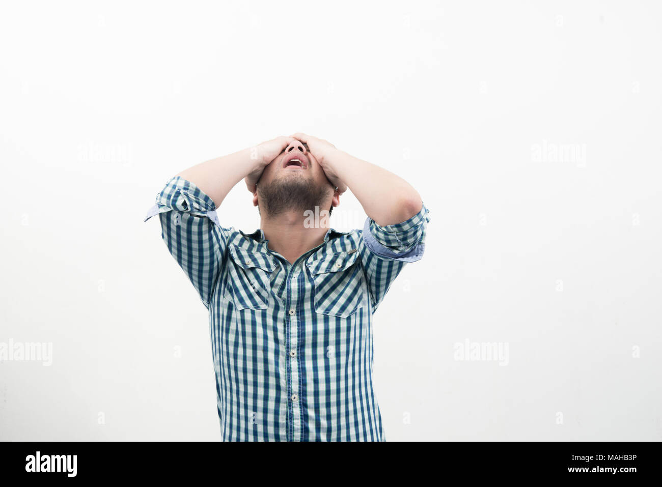 Man covering his face isolated on white background Stock Photo - Alamy