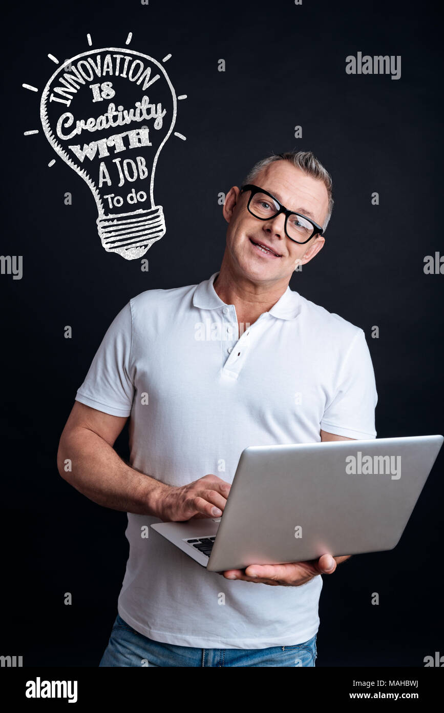 Smart HR manager holding a laptop while working Stock Photo Alamy