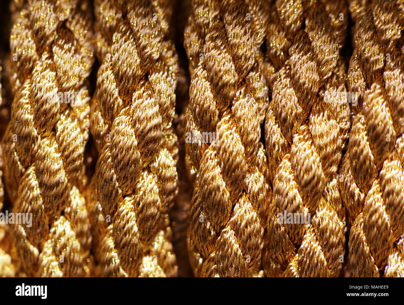 Gold braid rope photographed closeup Stock Photo Alamy