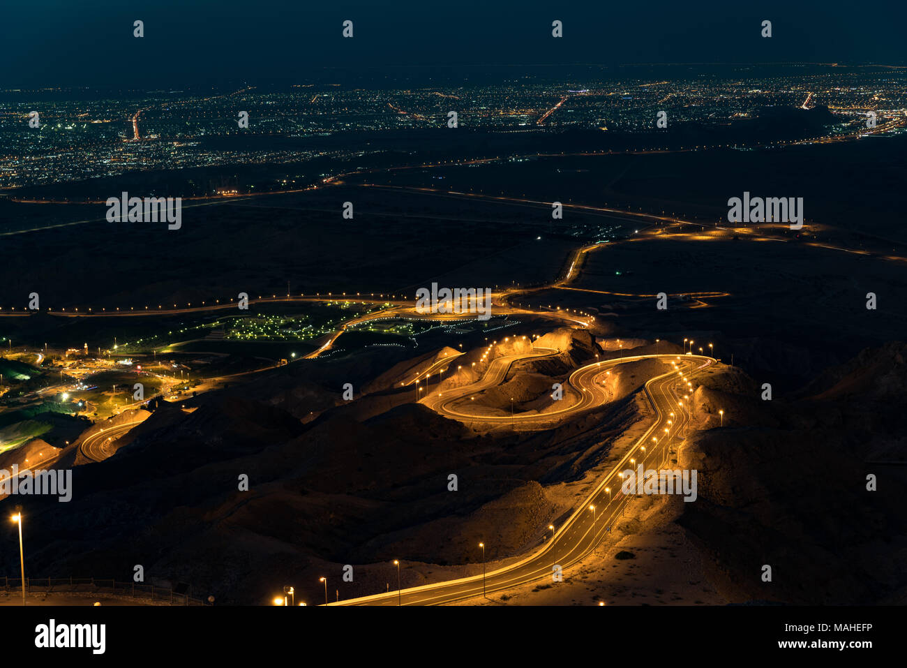 View to Al Ain from the top of Jebel Hafeet mountain. Just after sunset. Stock Photo