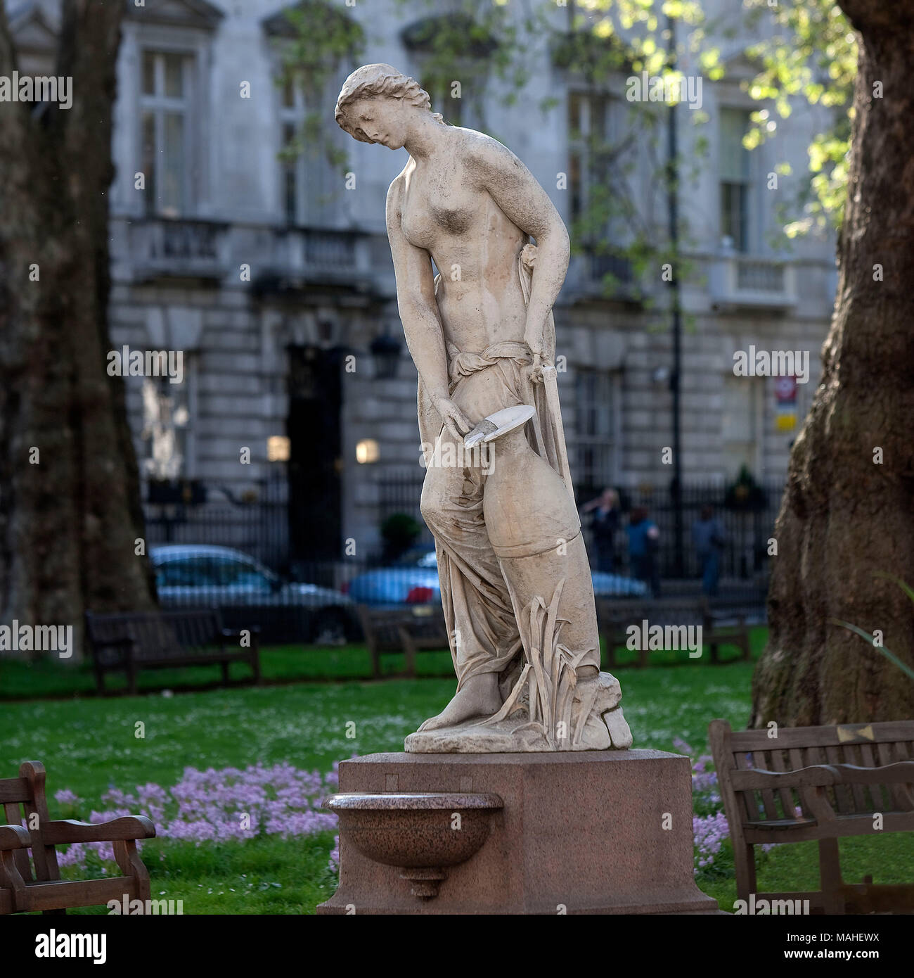 Berkeley Square fountain by Alexander Munro (1825 - 1871)  The sculptor of this statue on a drinking fountain at the bottom of Mayfair's Berkeley Squa Stock Photo