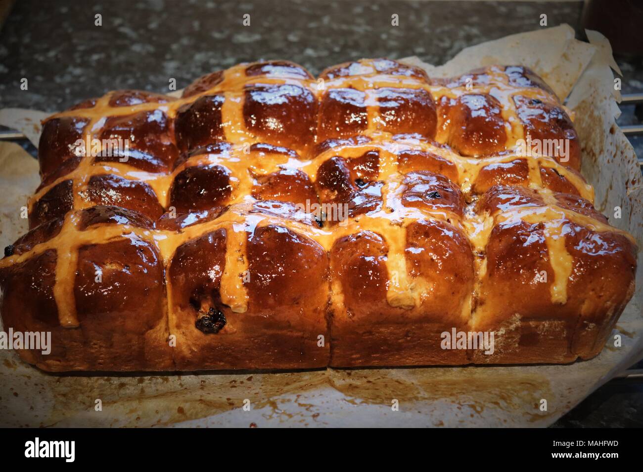 Highly Glazed Home Made Maple Hot Cross Buns Stock Photo