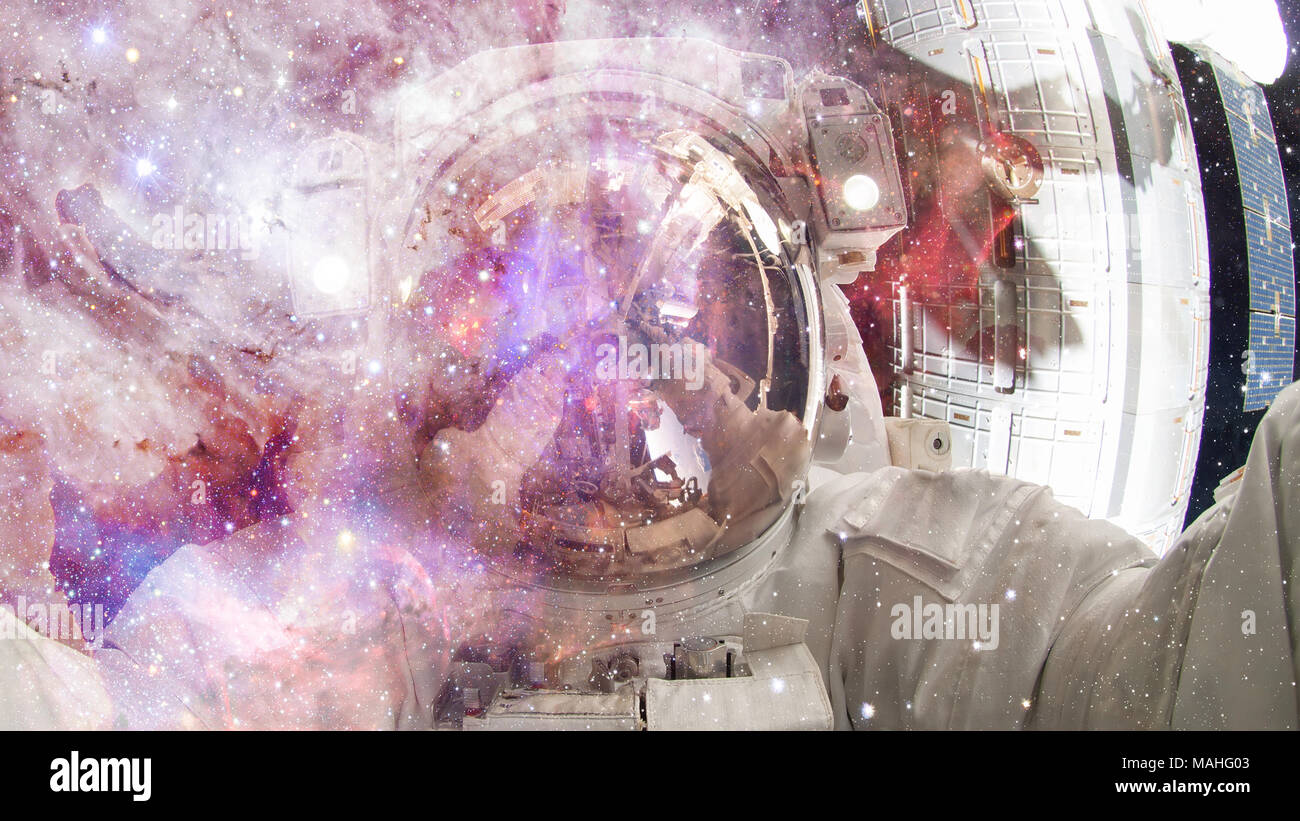 Astronaut in outer space. Science fiction art. Elements of this image ...