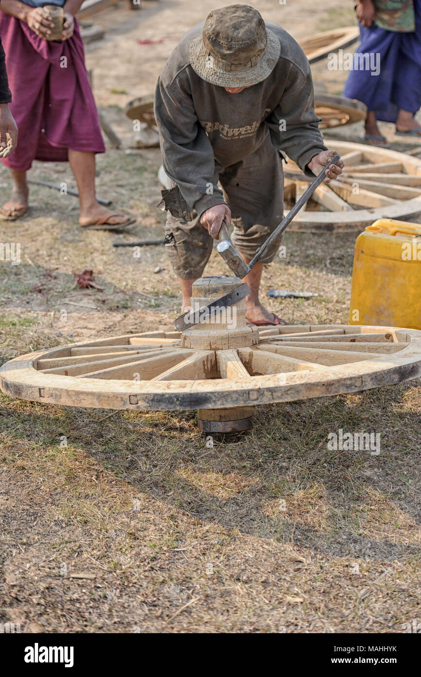 Repair and manufacture of wooden cart wheels in Taunggyi, Shan State Myanmar (Burma) Stock Photo