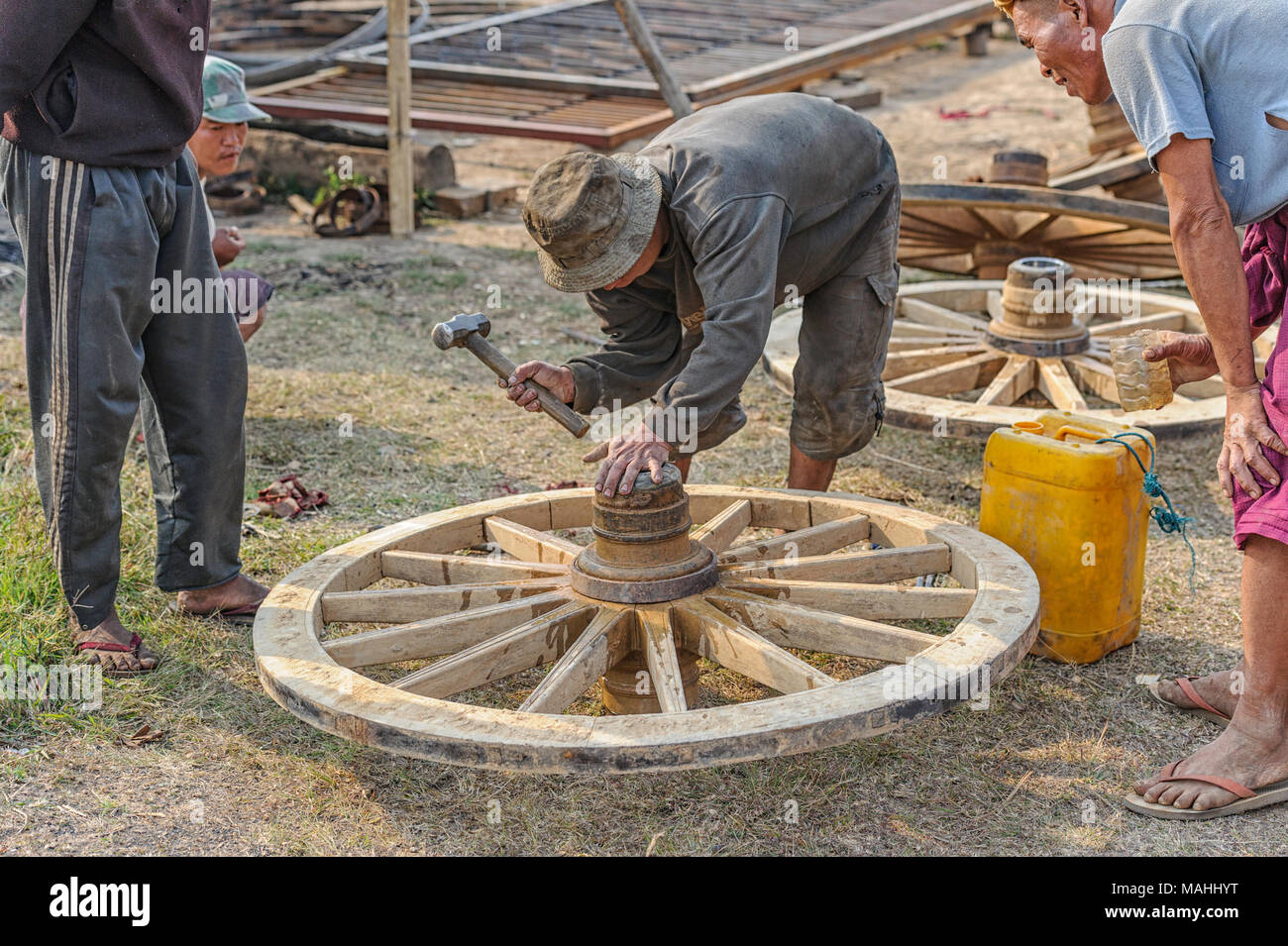 Repair and manufacture of wooden cartwheels in Taunggyi, Shan State Myanmar (Burma) Stock Photo