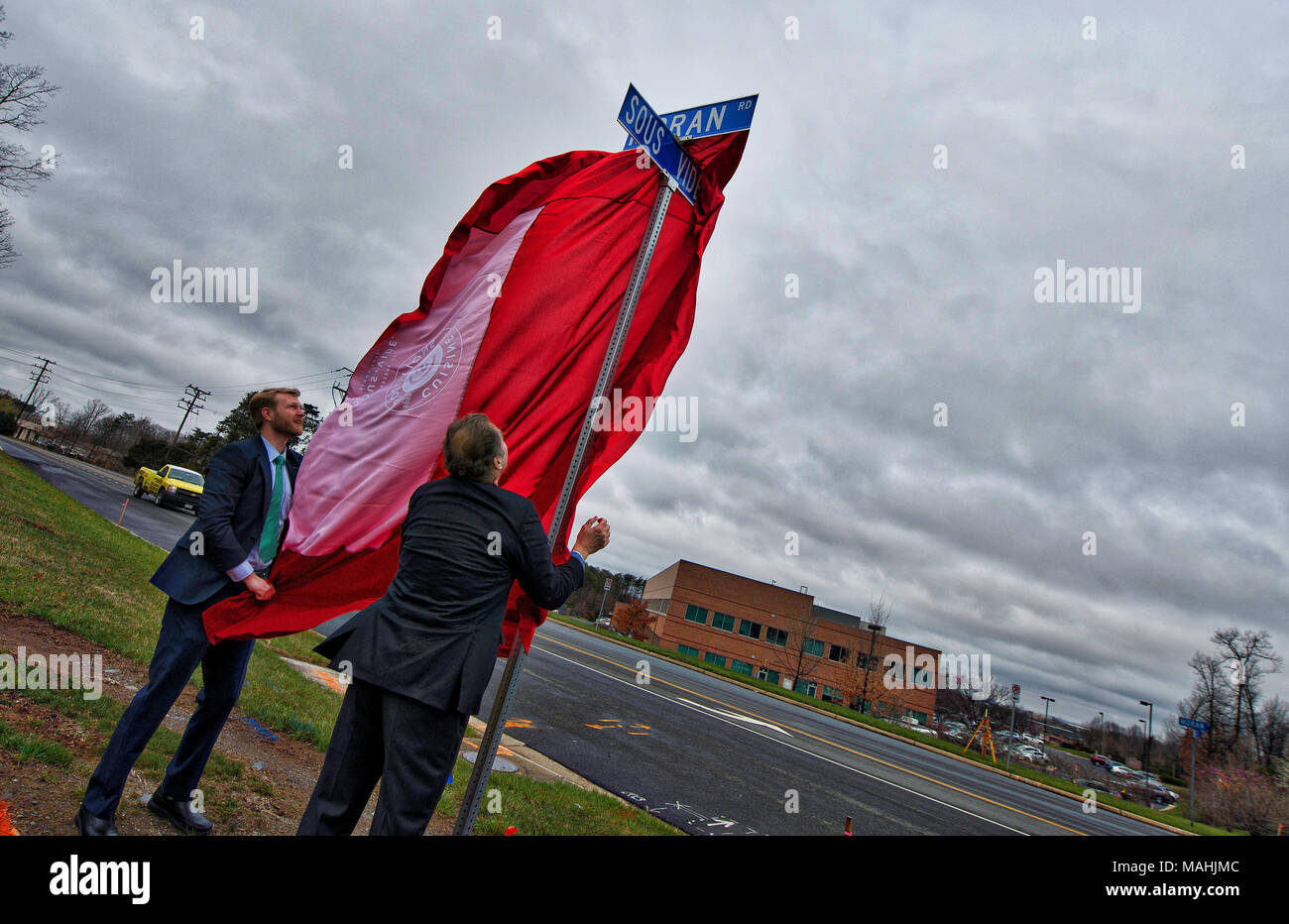 UNITED STATES: April 2, 2018: Broad Run Supervisor, Ron Meyers and Stanislas Vilgrain, Chairman and CEO of Cuisine Solution’s pulls the cover off of a Stock Photo