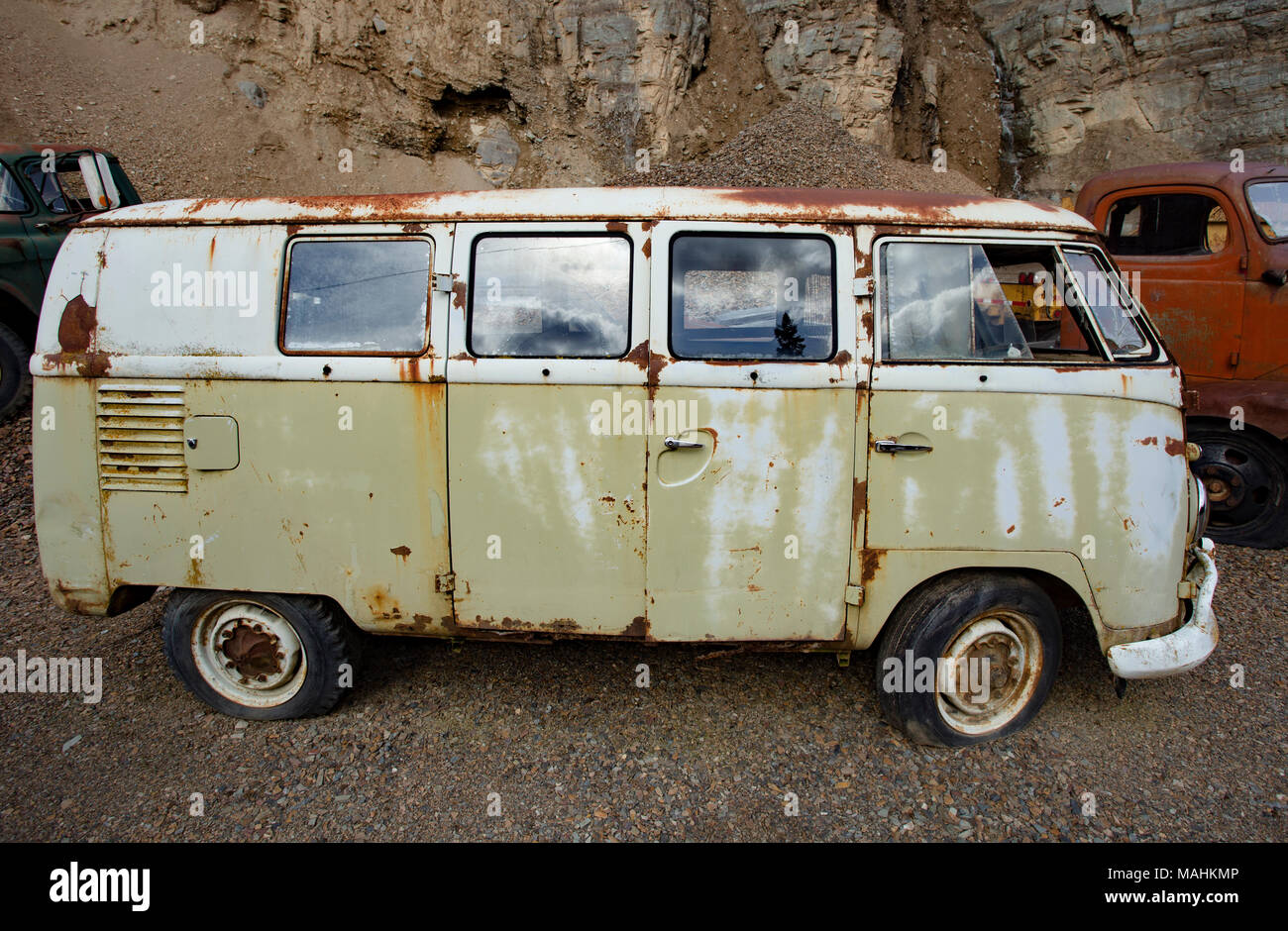 A rusty, mango green 1959 Volkswagen Microbus, in a stone quarry, east of Clark Fork Idaho. Stock Photo