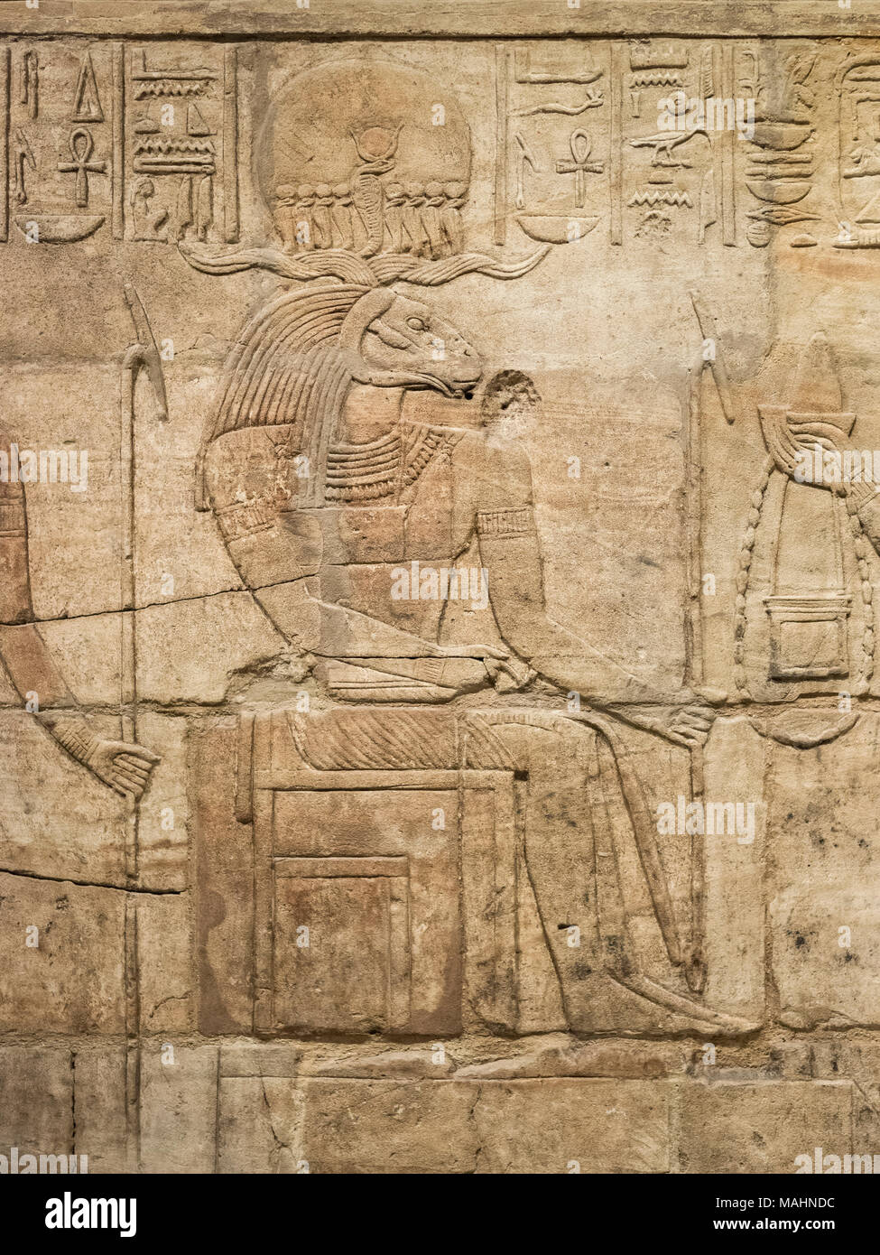 Oxford. England. Egyptian god Amun-Re (Amun / Amen Ra) with rams head, Shrine of King Taharqa (690–664 BC), Ashmolean Museum. Detail of bas-relief on  Stock Photo