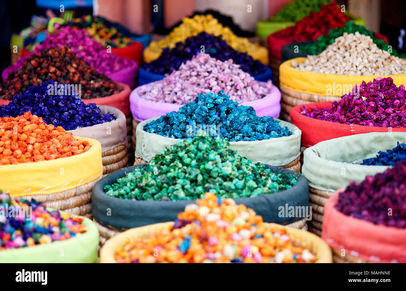 Multicolored dried flowers, used for soaps and perfumes as well as coloring, dyes and as an ingredient in foods, on sale in the souks of Marrakesh's m Stock Photo