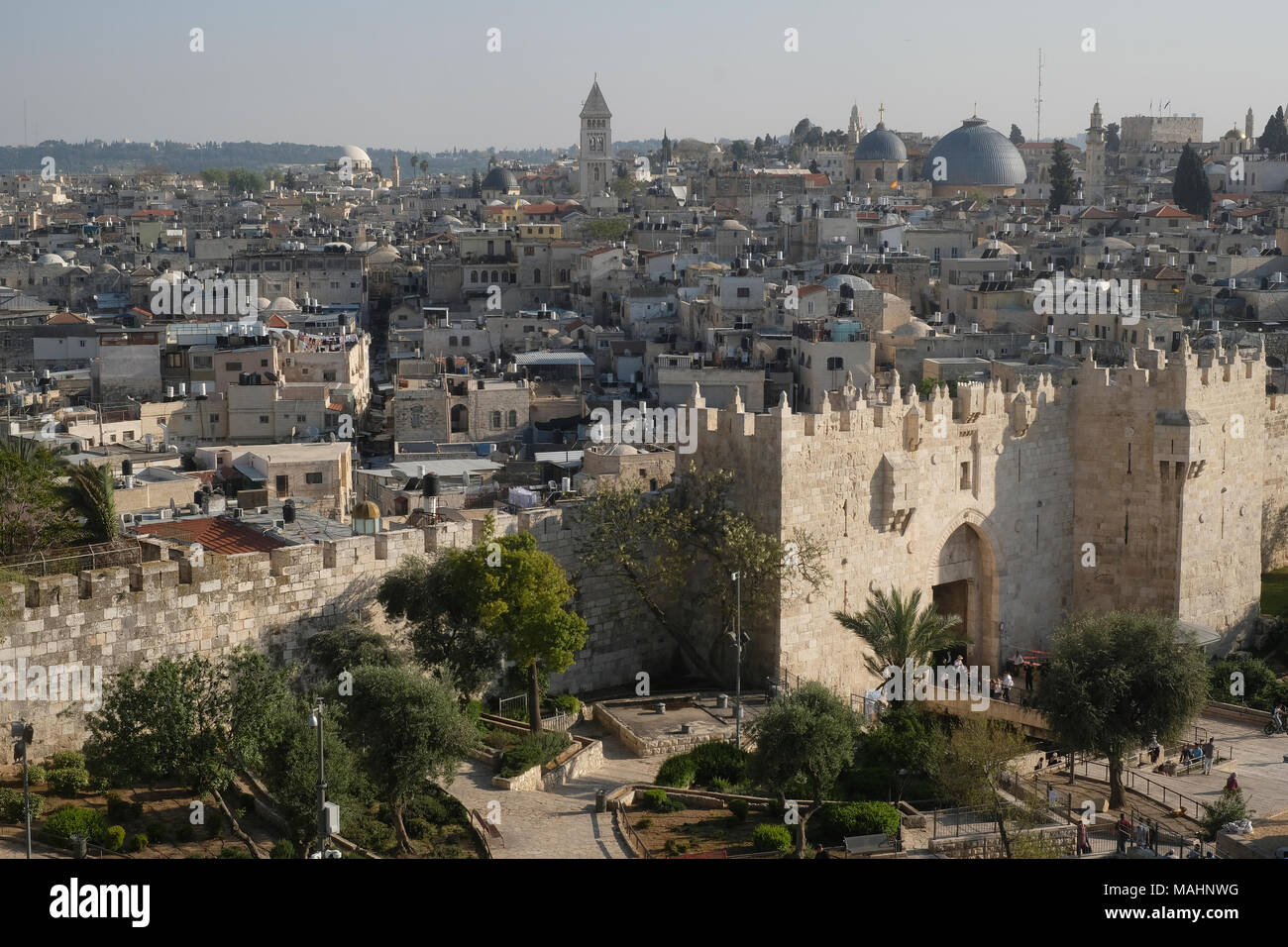 View of the rooftop of the Muslim and Christian quarter across Nablus Gate or Bab al-Amud also called Damascus gate at the northern edge of the Ottoman walls surrounding the old city of East Jerusalem Israel Stock Photo