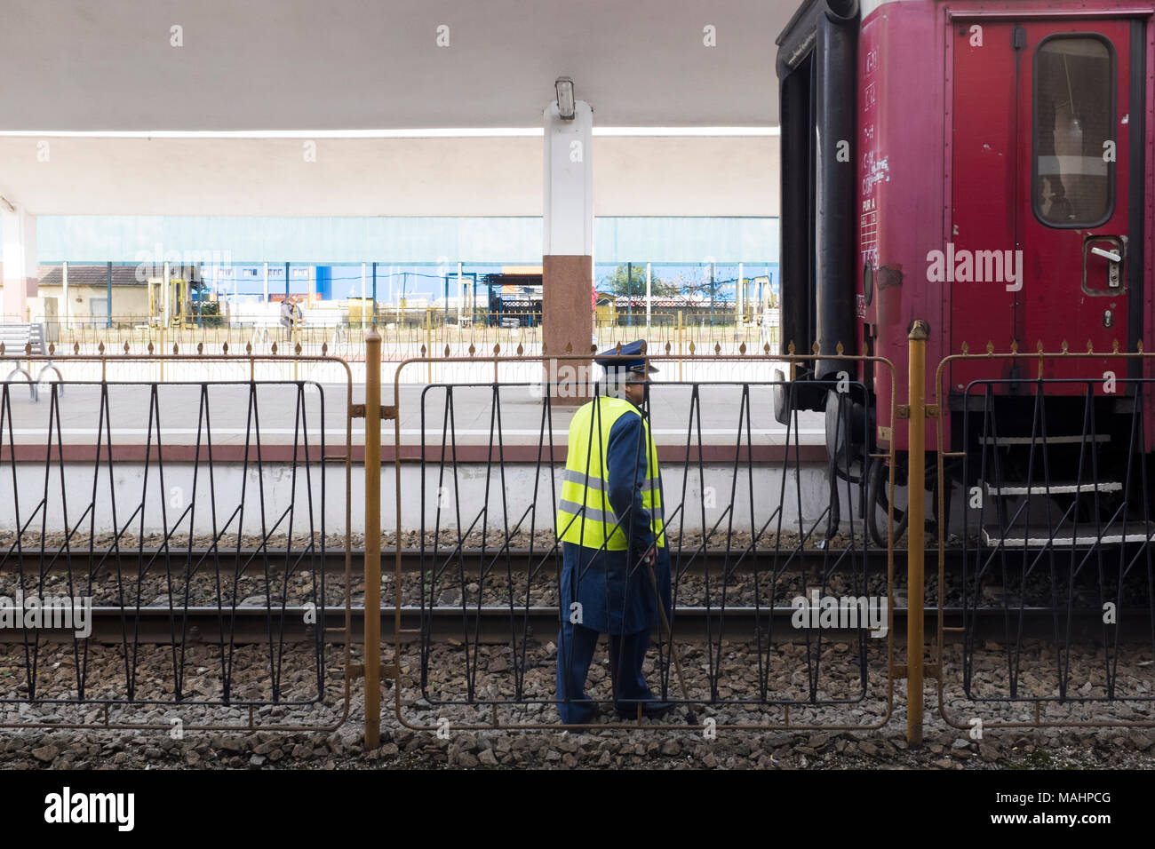 A train guard checks the wheels on the carriages at Cluj Napoca Train Station, Romania. Stock Photo