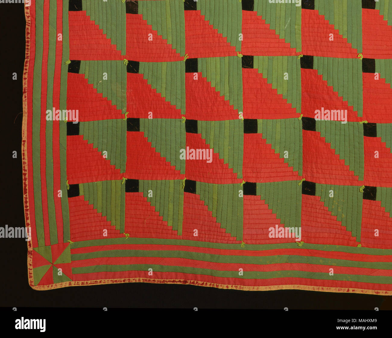 Predominately green and red wool log cabin style patchwork quilt. Title ...