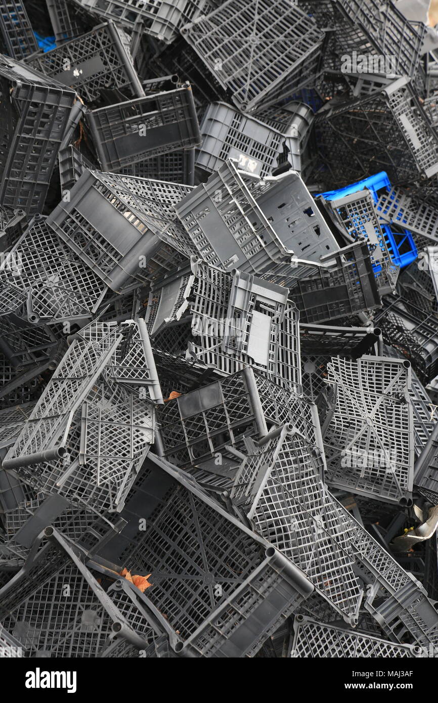 Piled black crates for scrap Stock Photo