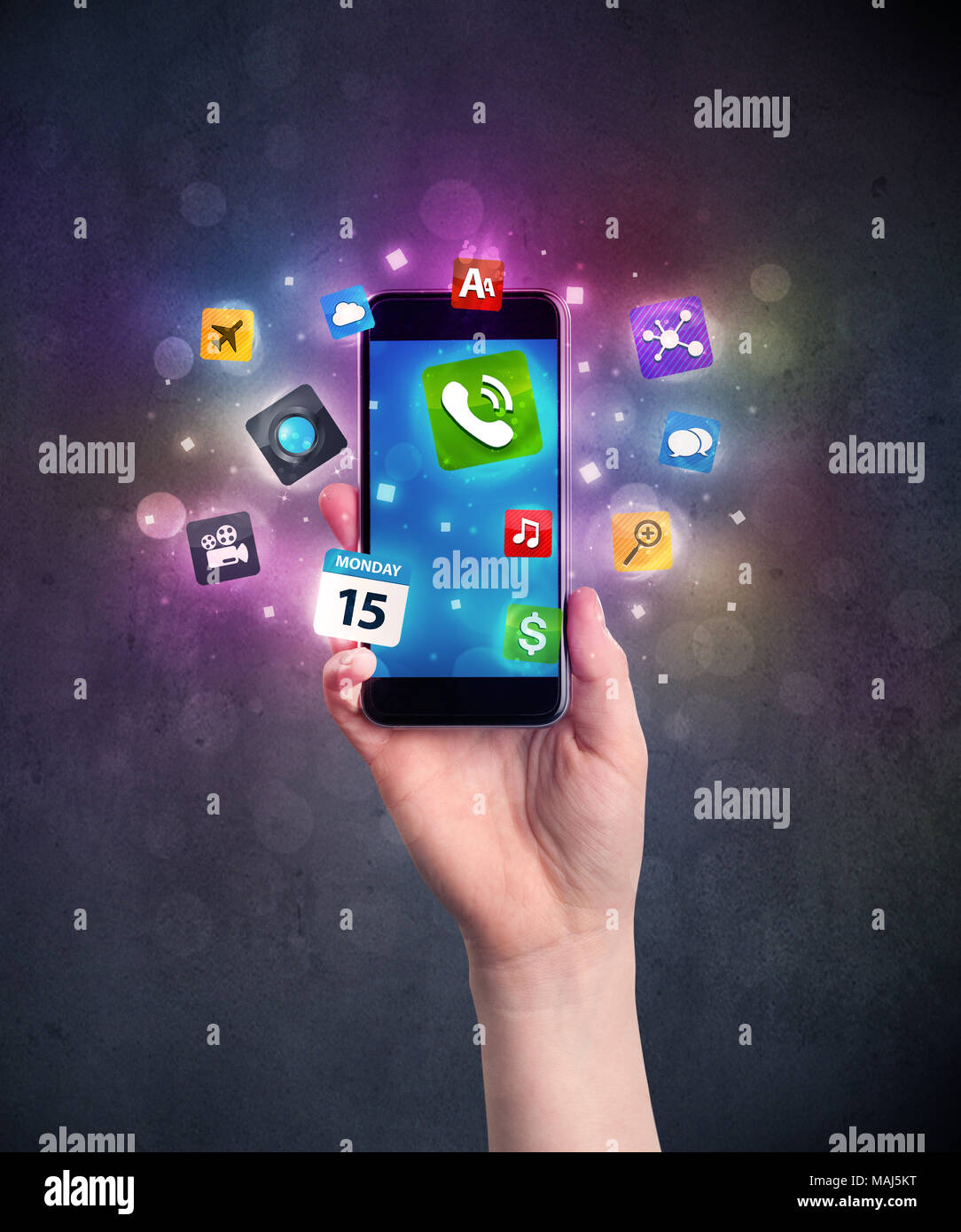 Caucasian hand in business suit holding a smartphone with colorful ...
