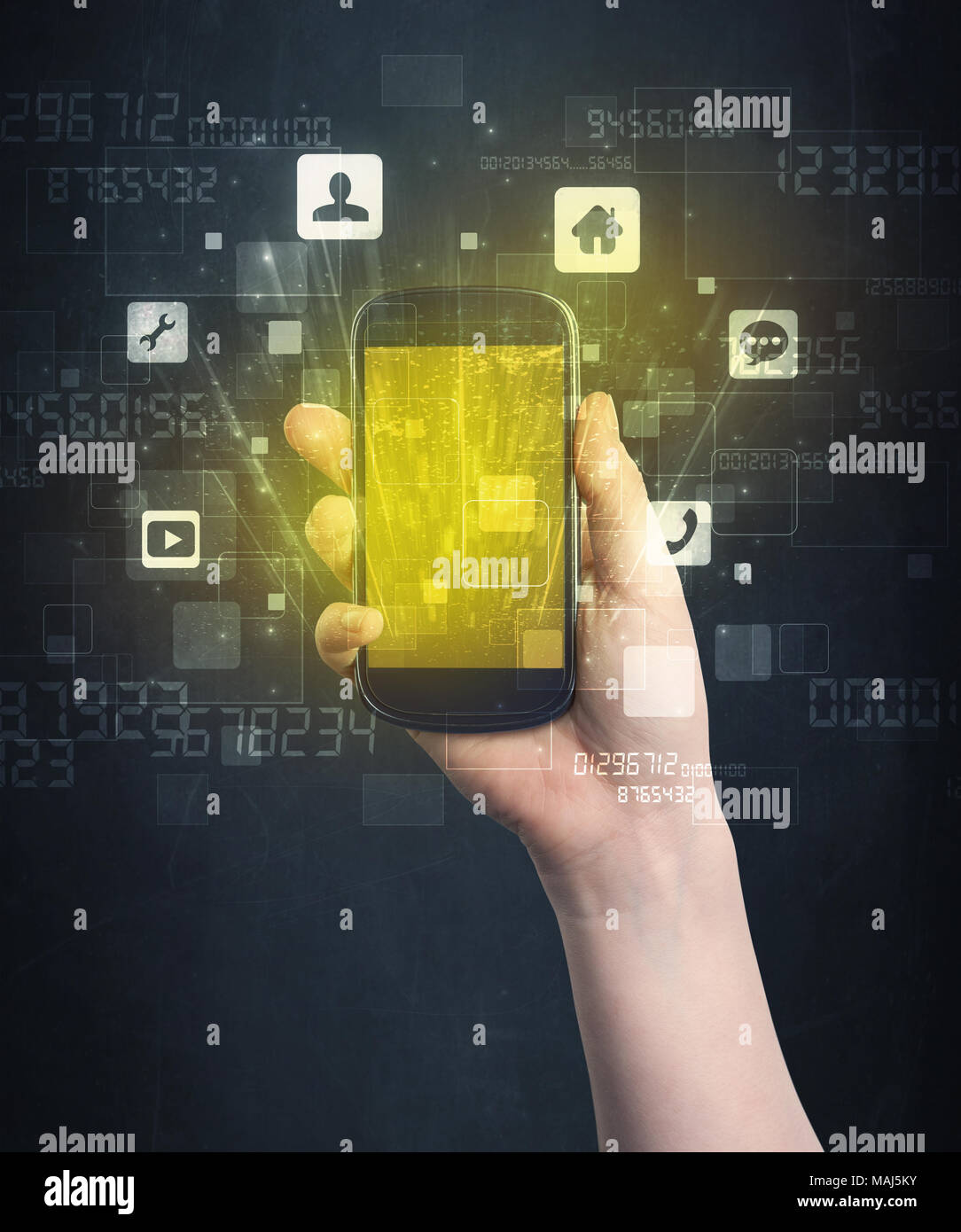 Caucasian hand in business suit holding a smartphone with golden-yellow ...