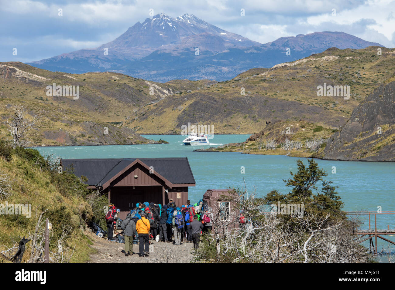 Hikers waiting for Hielos Patagonicos, Sightseeing boat on Lago Pehoe, Torres del Paine National Park, Patagonia, Chile Stock Photo
