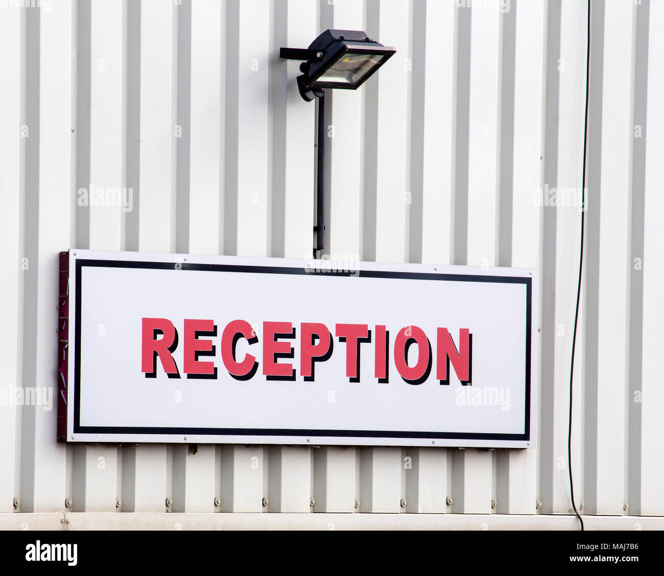 Reception sign above industrial unit office entrance Stock Photo