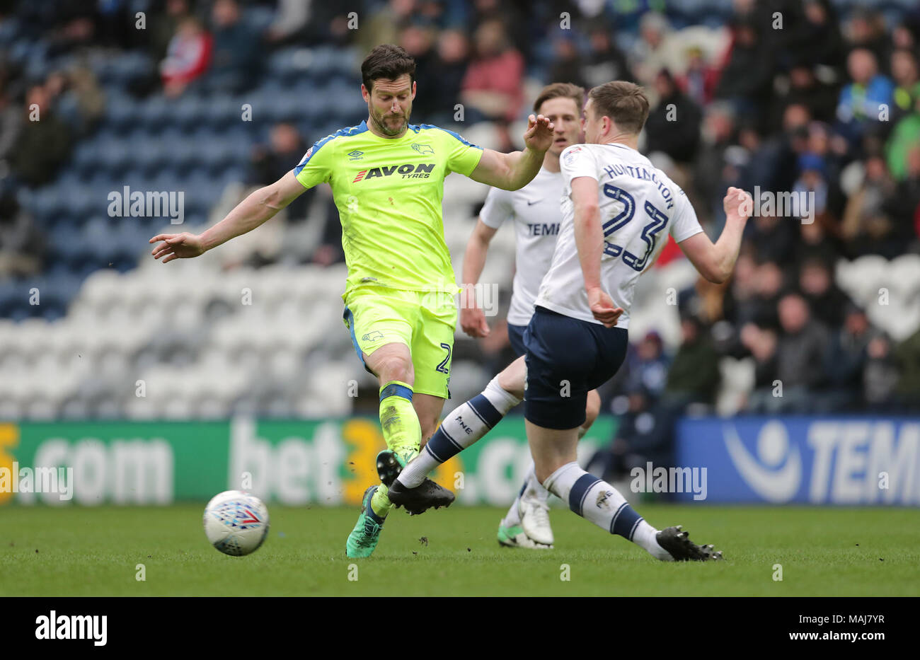 Derby County's David Nugent (left) and Preston North End's Paul Huntington battle for the ball during the Championship match at Deepdale, Preston. Stock Photo