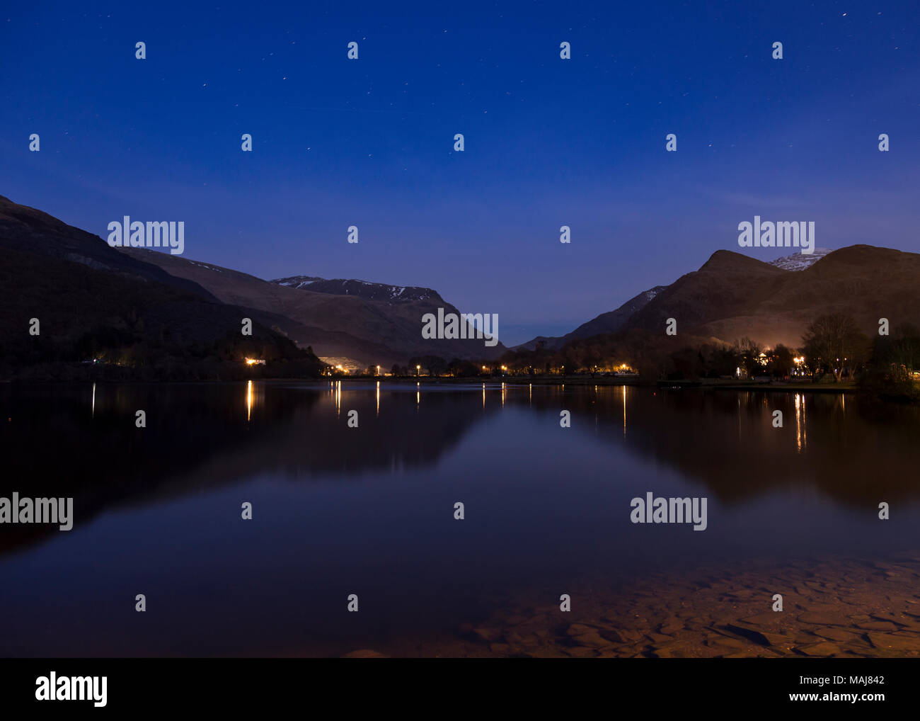 Mountains reflecting in Llyn Padarn at night, Snowdonia, North Wales in winter Stock Photo