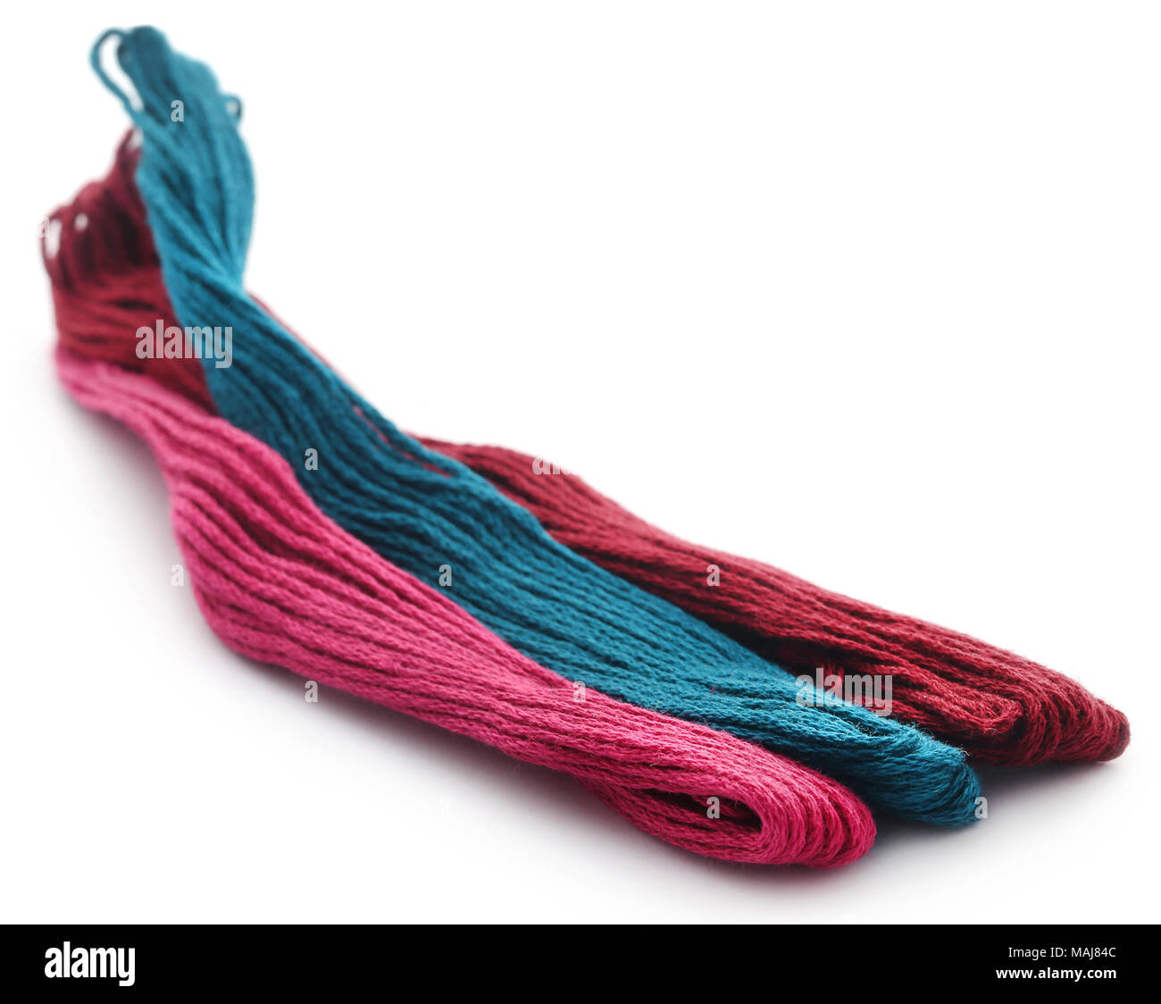 Woolen thread over white background Stock Photo - Alamy