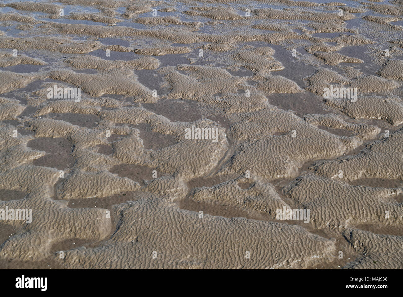 Morecambe bay Mud Flats, ripples and patters formed by the movement of ...
