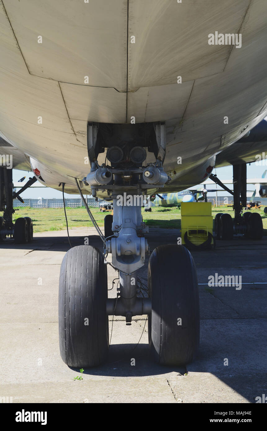 Photo of a white airplane chassis on the ground Stock Photo Alamy