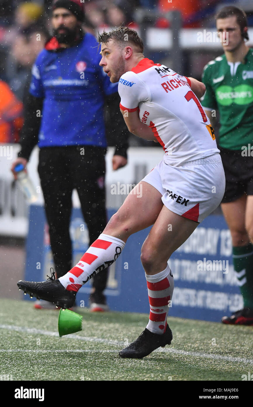St Helens’ Danny Richardson kicks during the Betfred Super League match at the Select Security Stadium, Widnes. Stock Photo