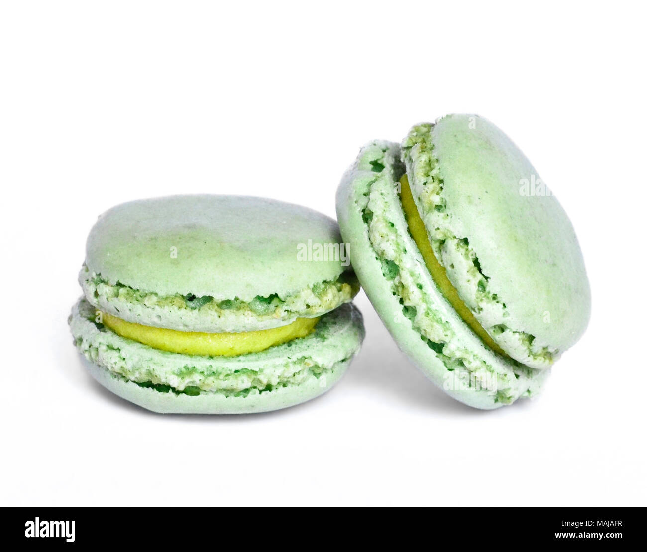 Fresh macrons or macaroon, french pastry. Colorful macaron, isolated on white background. Stock Photo