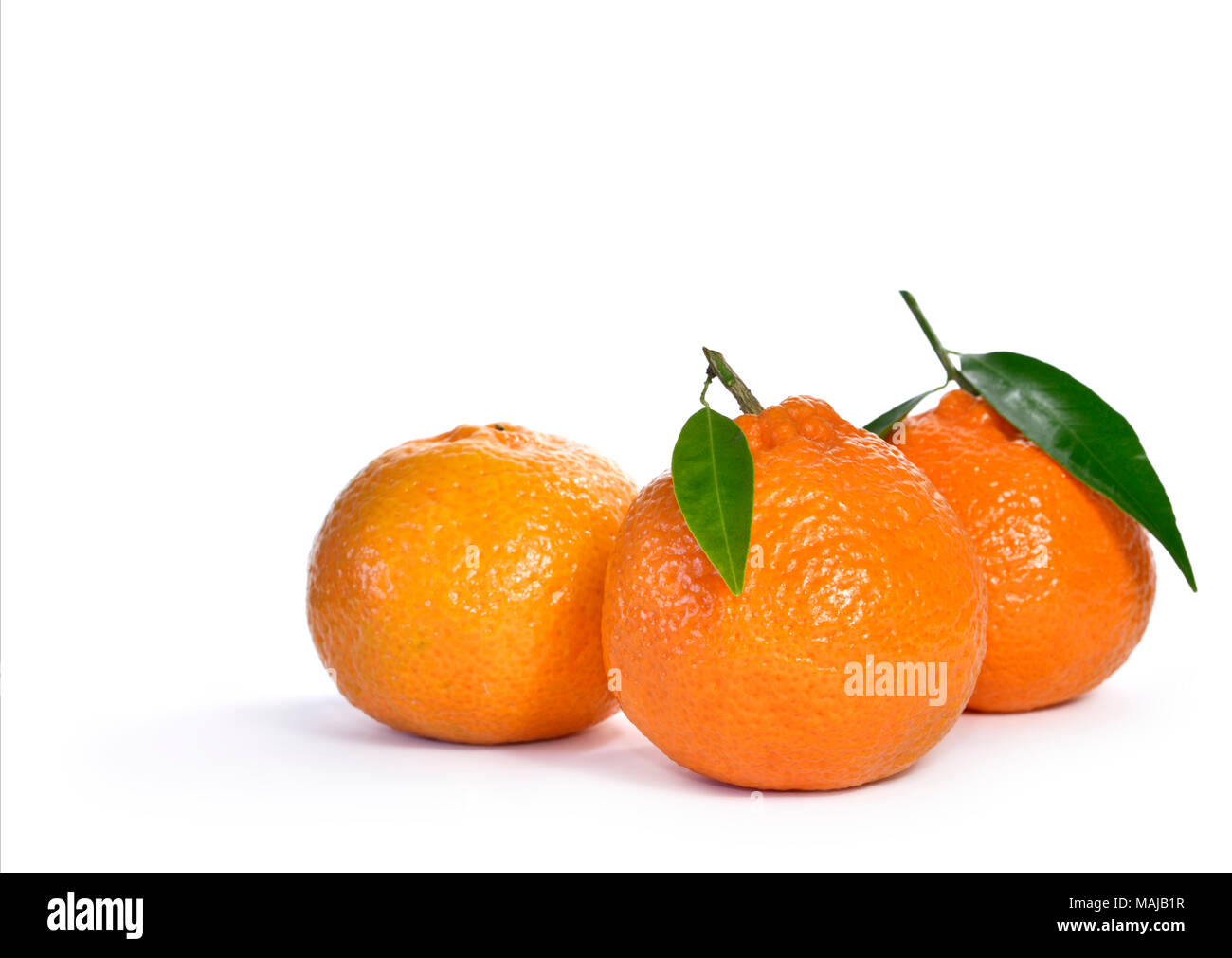 Fresh and juicy oranges with leaf, isolated on white background. Orange