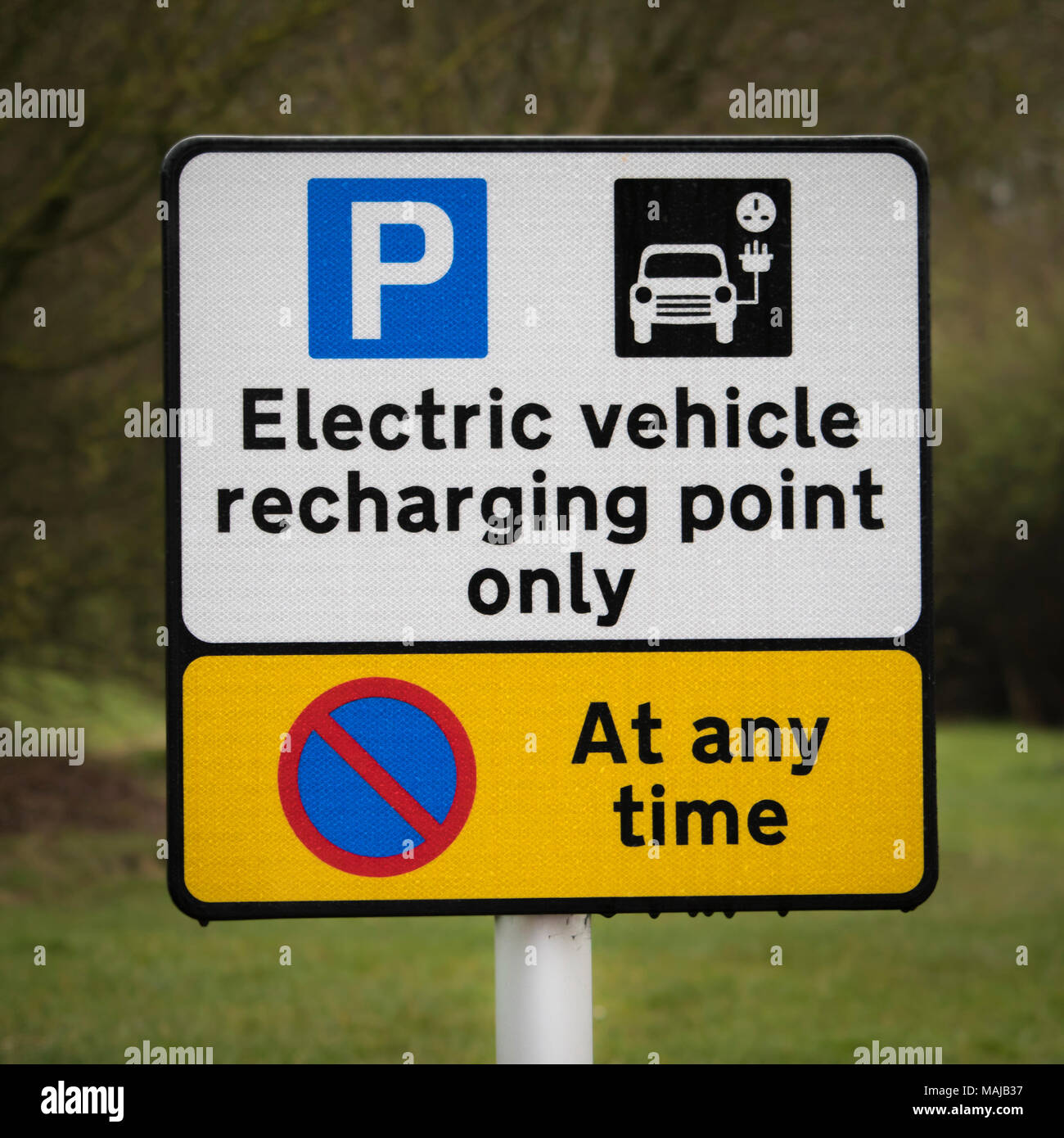 Electric car recharging point sign at a motorway service station Stock ...