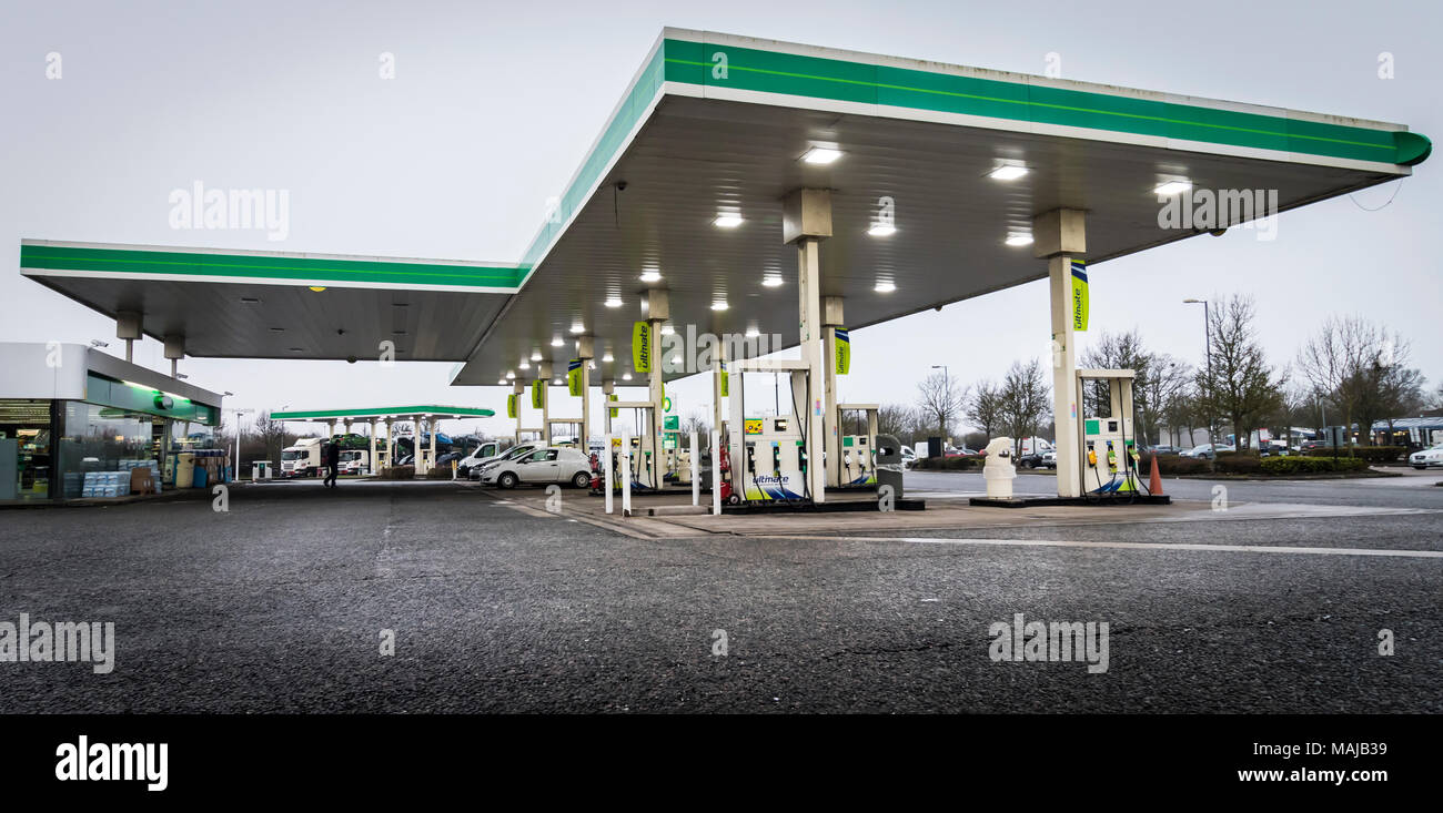 A petrol station within a motorway service station selling dieasel and petrol fuels Stock Photo