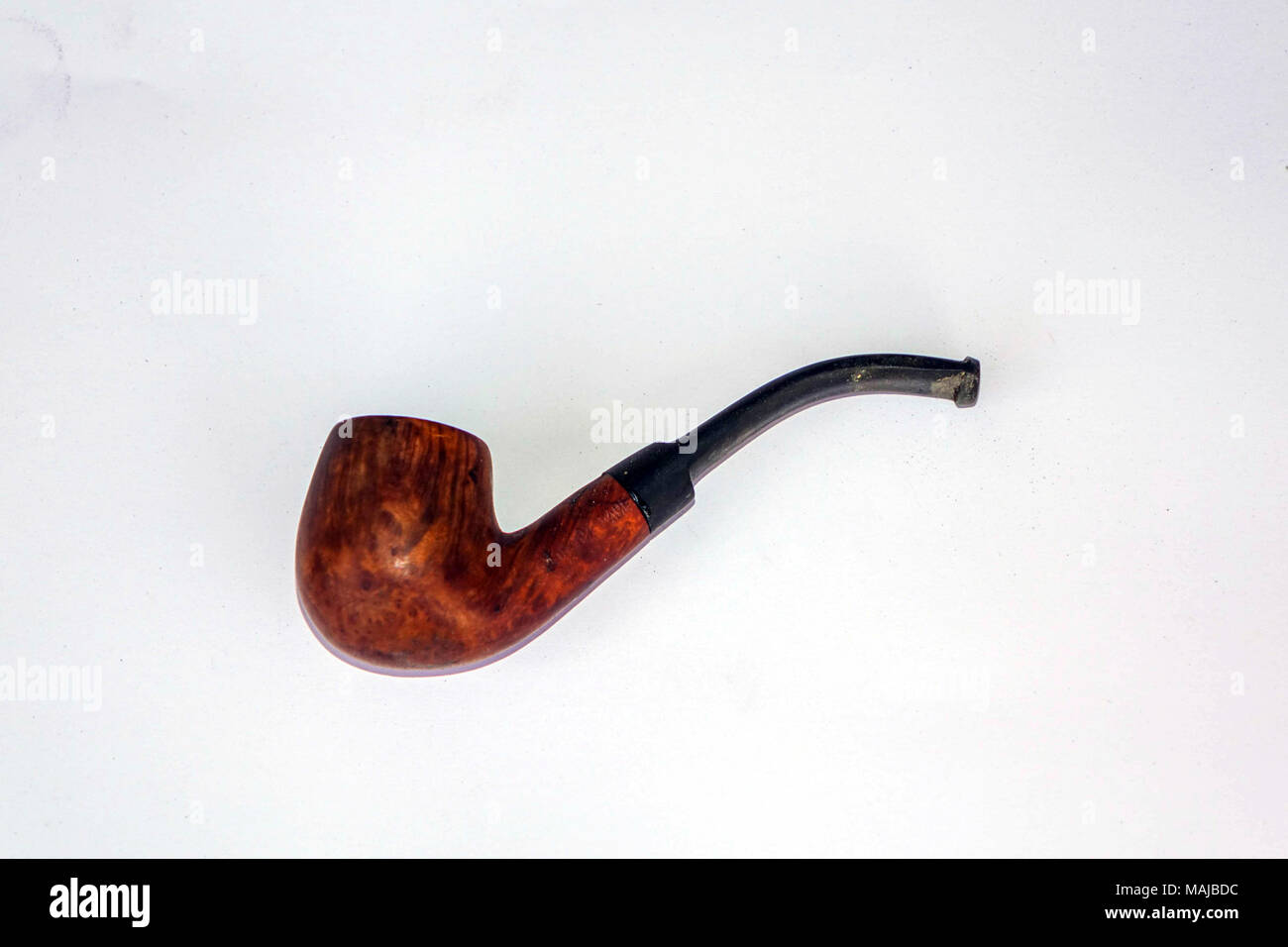 Used wooden smoking pipe against white background, in Turkey Stock Photo