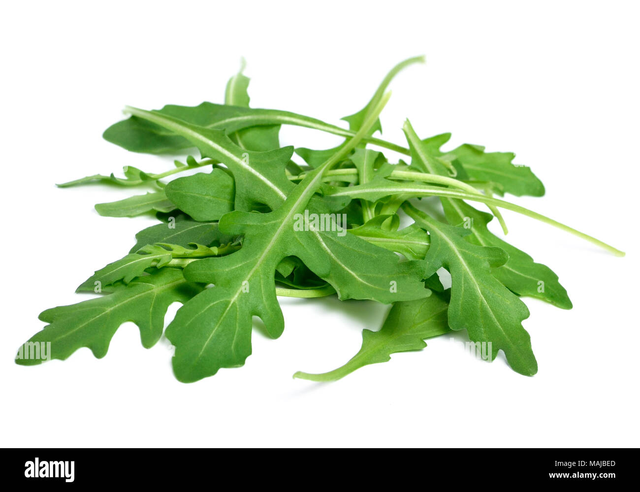 Fresh arugula or rocket leaves, isolated on white background. Arugula salad. Stock Photo
