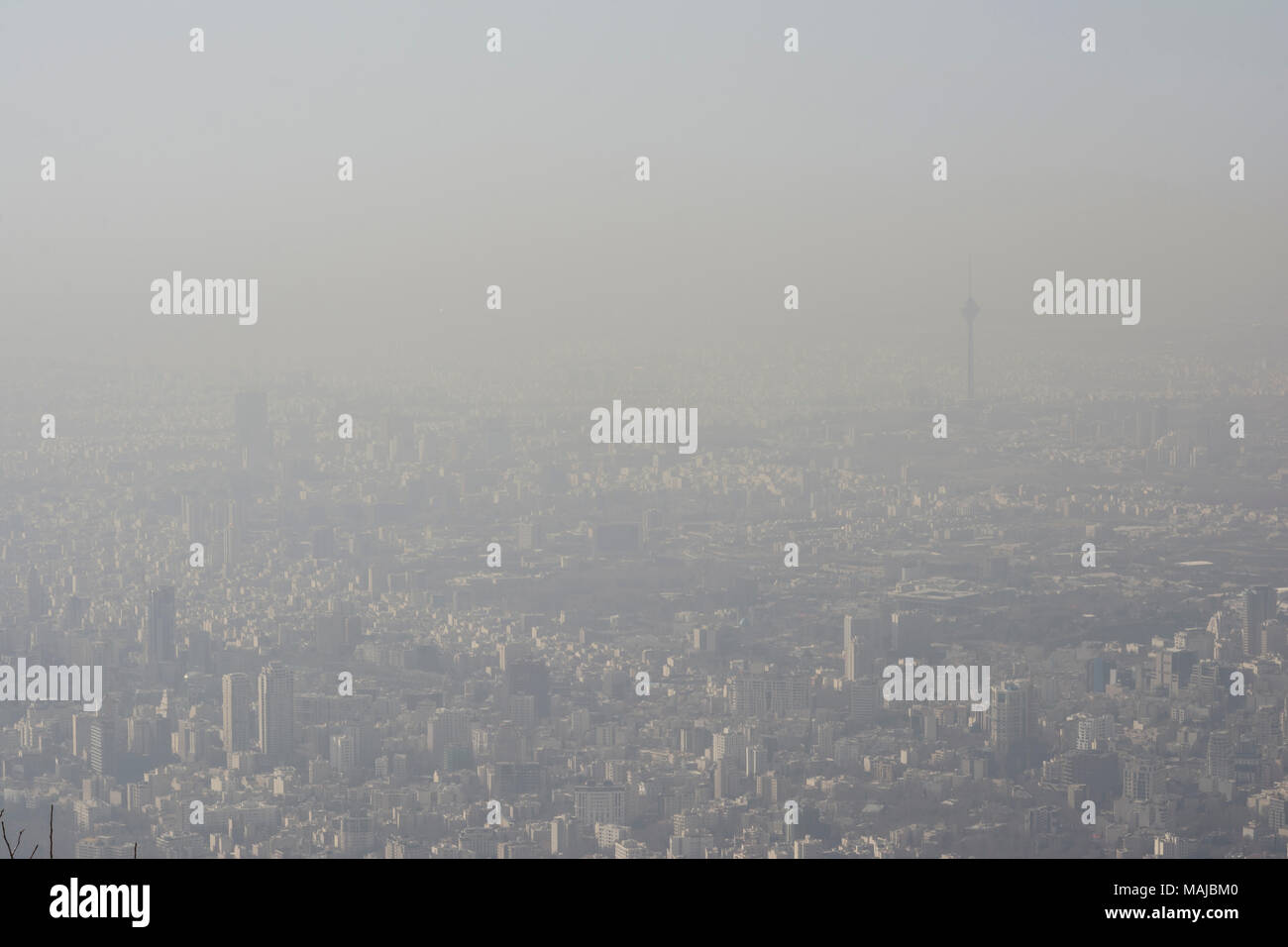 Aerial view of Tehran city from mountains side, air-polluted skyline. Stock Photo