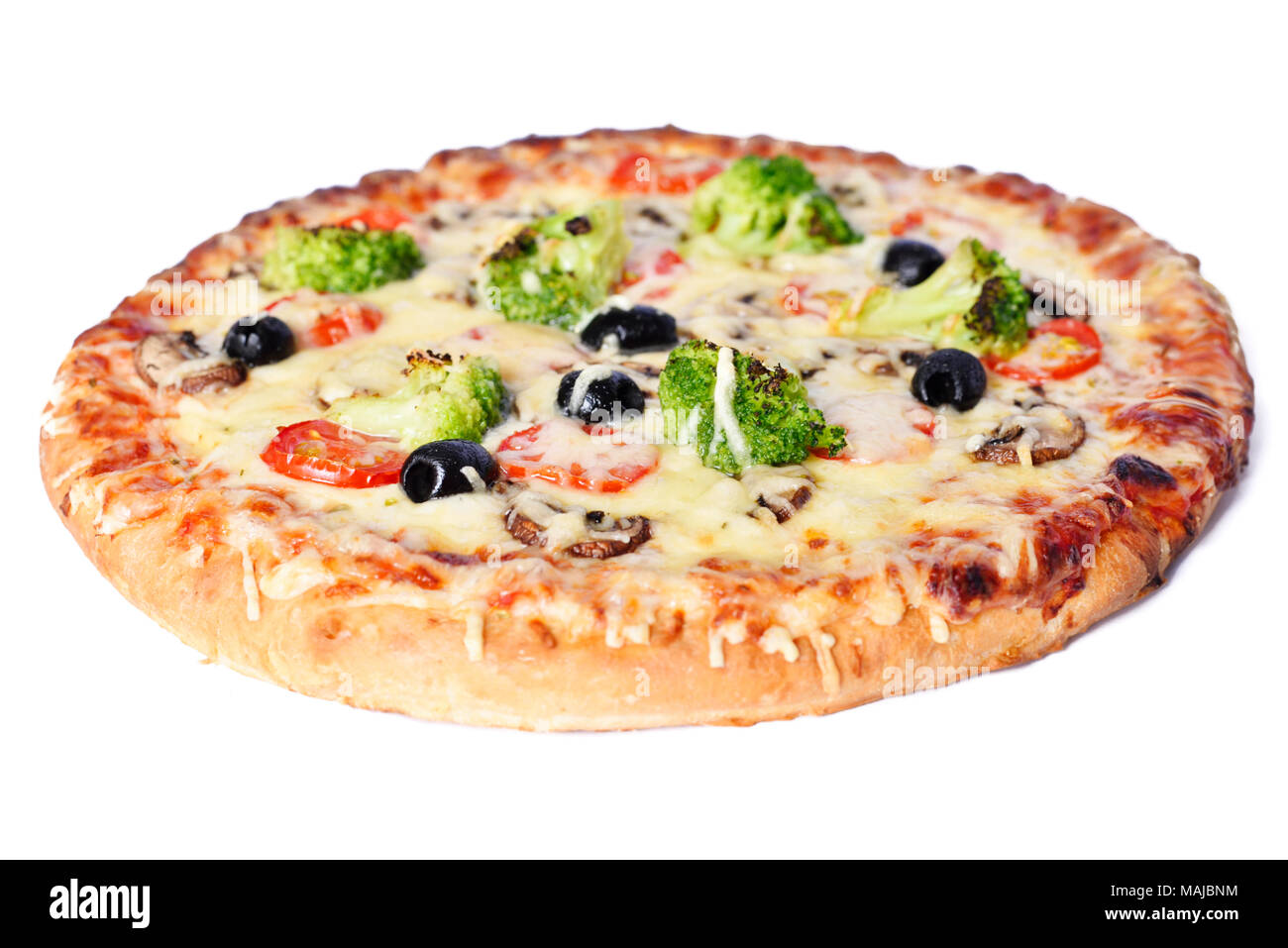 Vegetable pizza, isolated on white background.High angle view of a vegetarian pizza with mushrooms, fresh tomatoes, olives, broccoli and cheese. Stock Photo