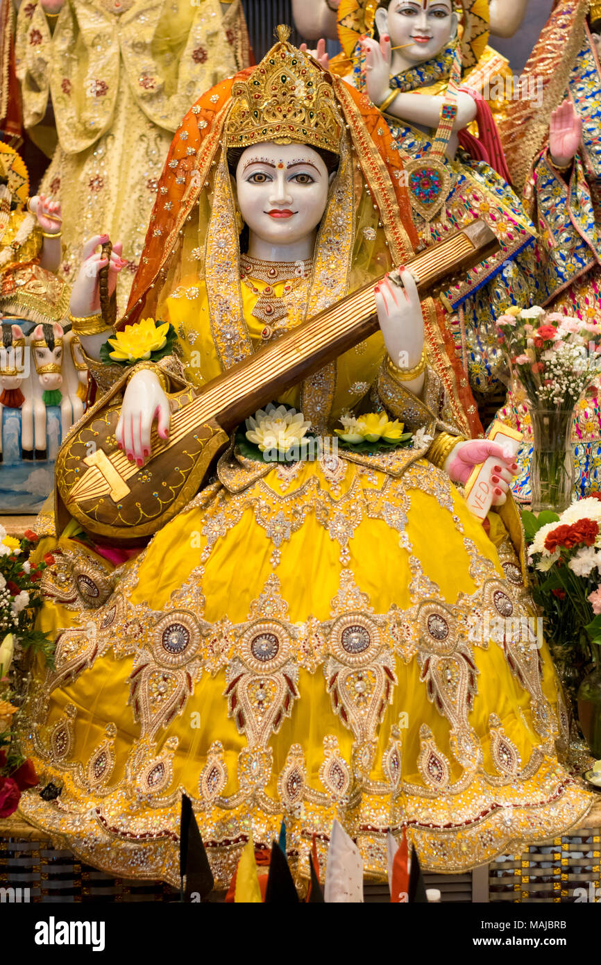 A statue of Saraswati, the Hindu Goddess of music at the Tulsi Mandir temple in South Richmond Hill, Queens, New York. Stock Photo