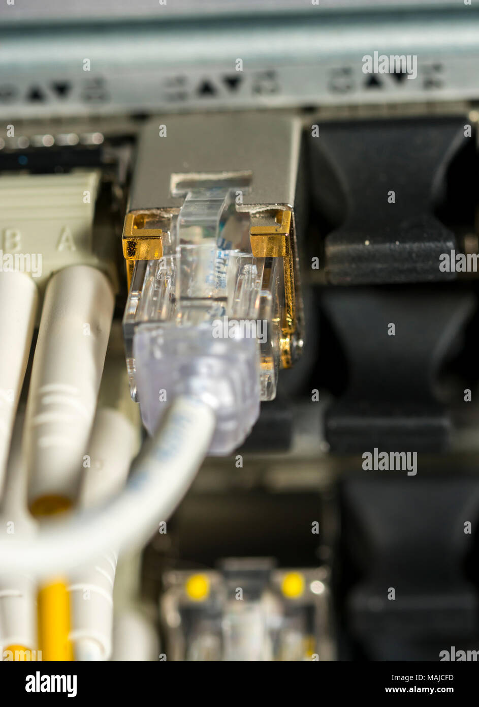 Network cables and servers in a technology data center  Network cables in switch Stock Photo