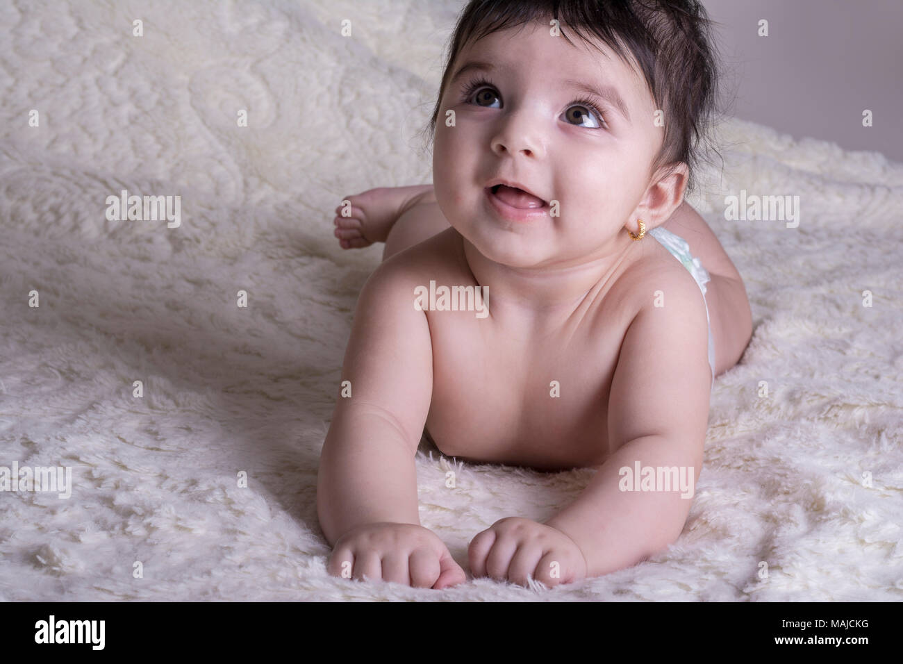 Baby girl wearing diaper on hires stock photography and images Alamy