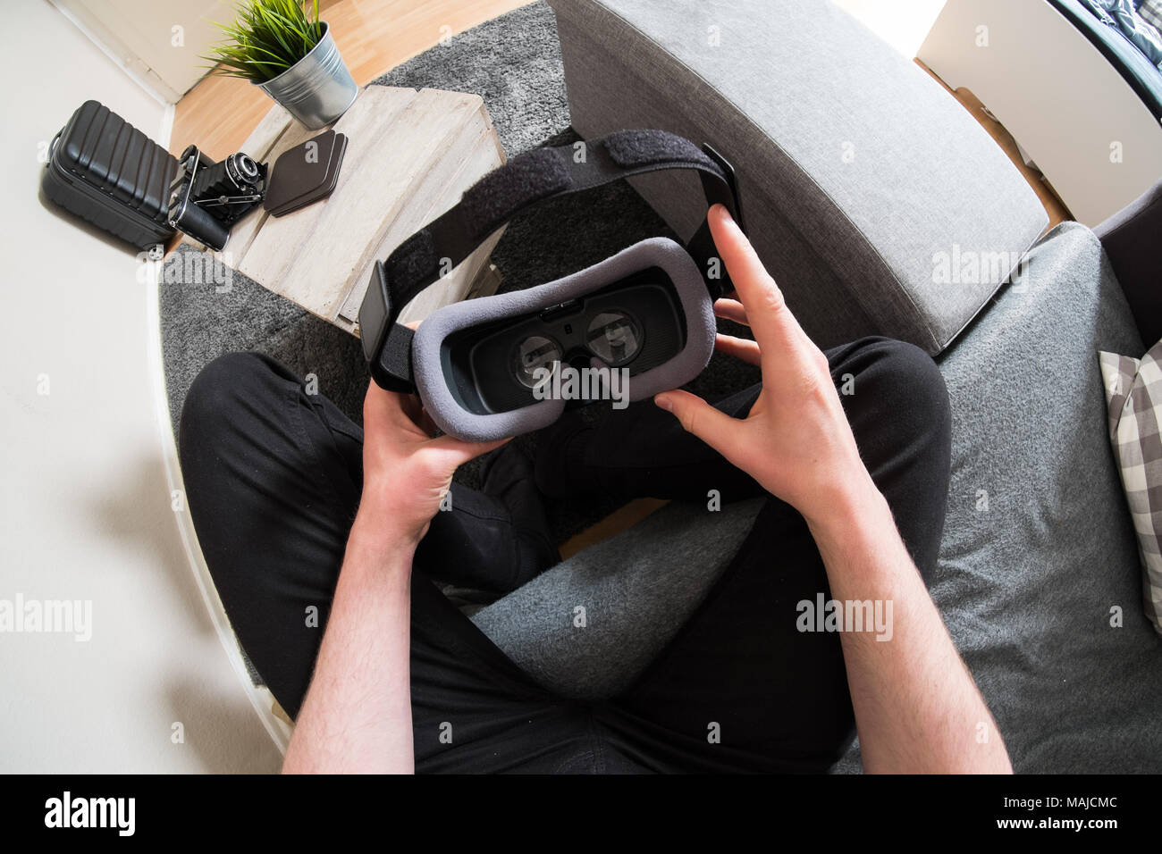 Male hands holding virtual reality headset Stock Photo