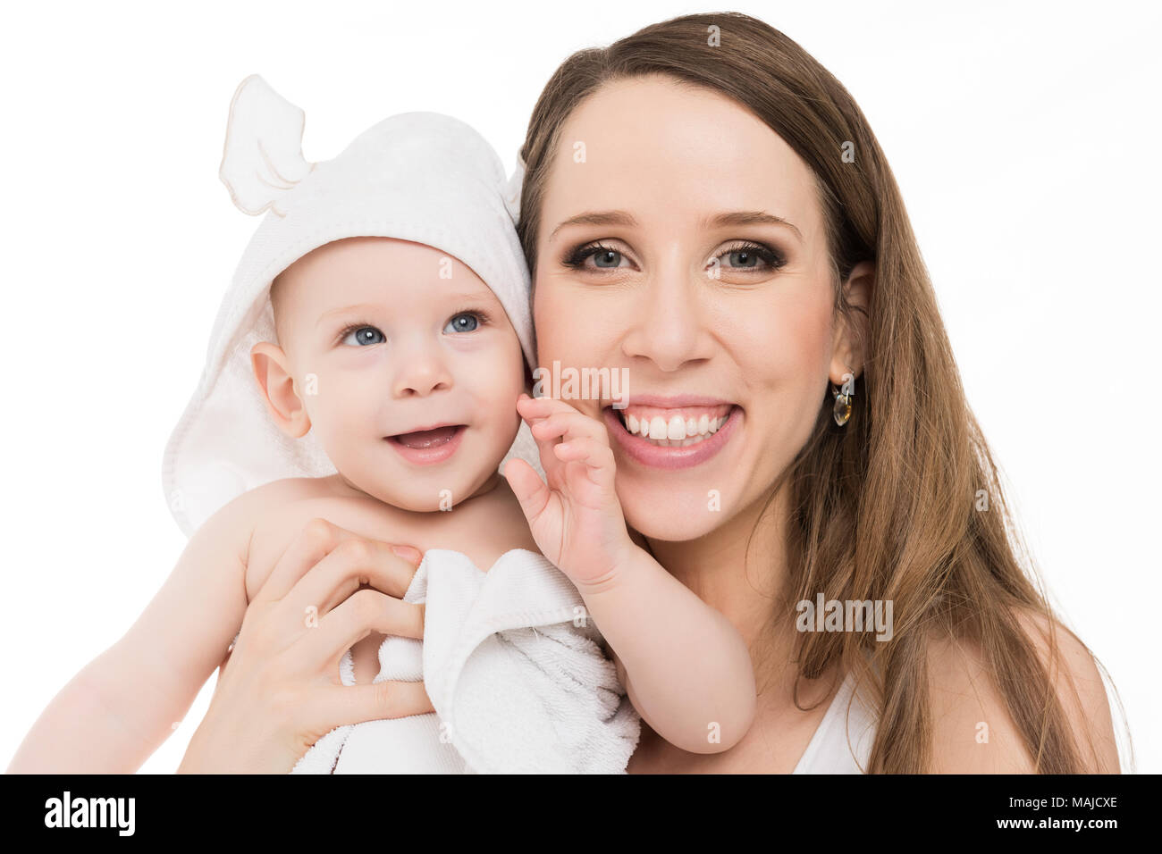 Happy mother hugging her adorable baby son. Happy family. Mother and newborn child portrait isolated on white background. Stock Photo