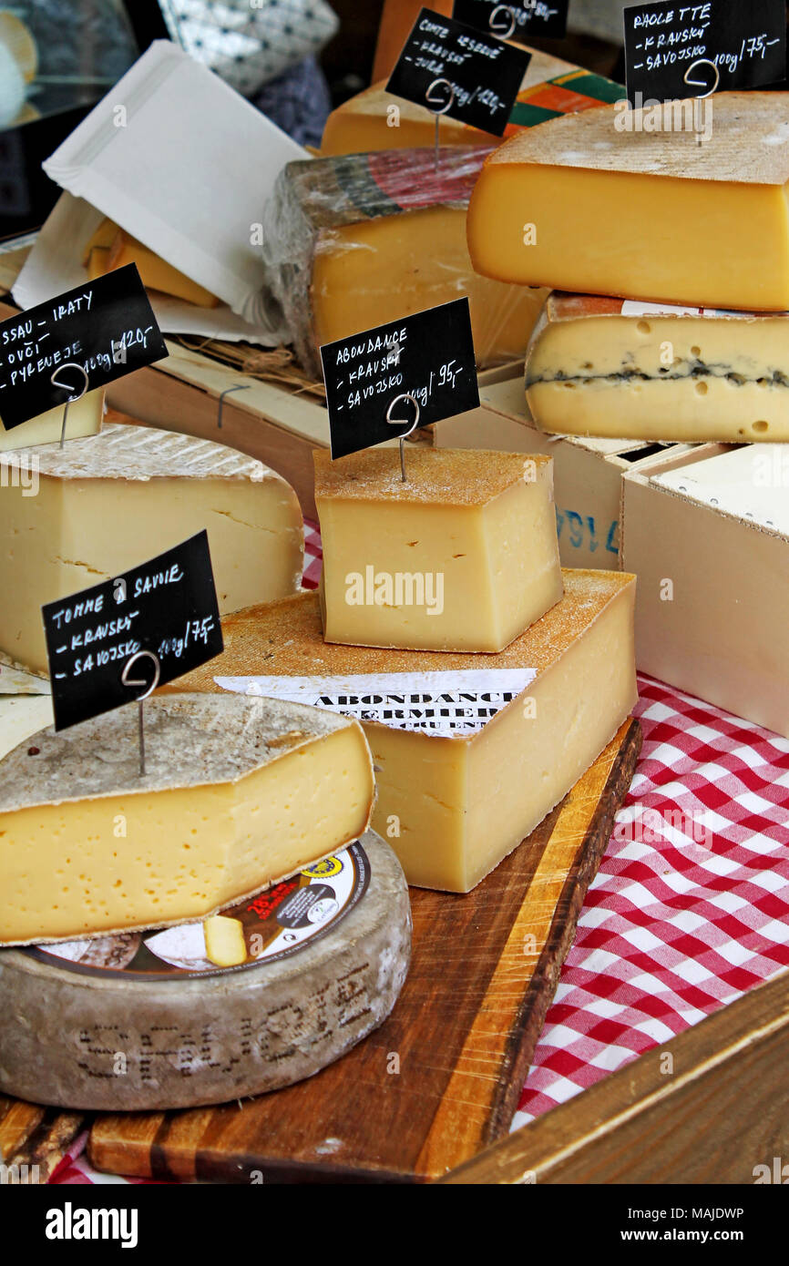 Various types of cheese on table. Cheese with label for sale at a market. Czech Republic. Stock Photo