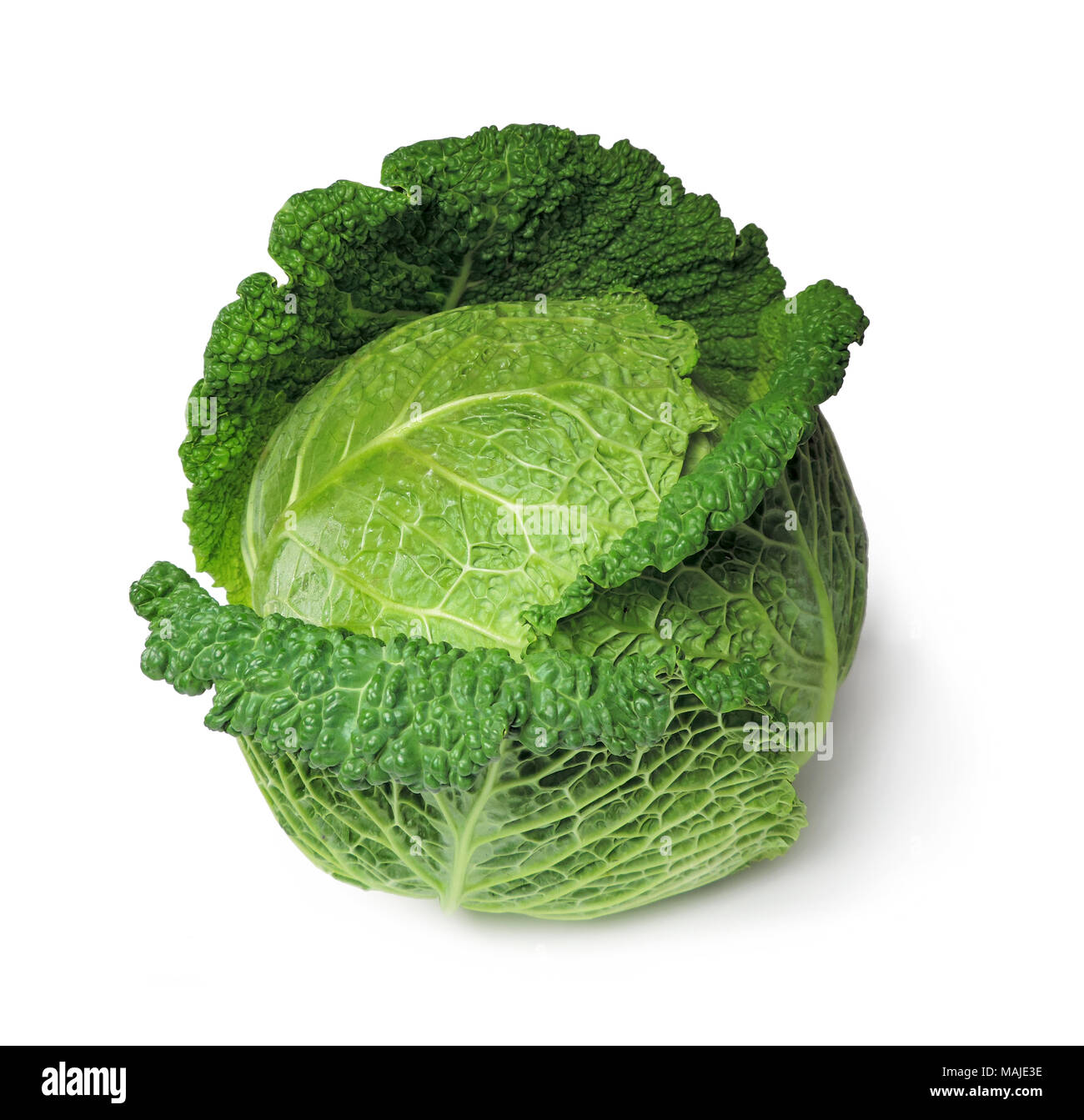 Raw savoy cabbage, isolated on white background. Whole, ripe cabbage, dieting vegetable, healthy eating. Stock Photo