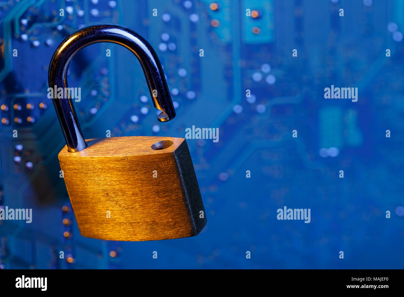 Digital security concept with space for text. Open lock against the chip background Stock Photo